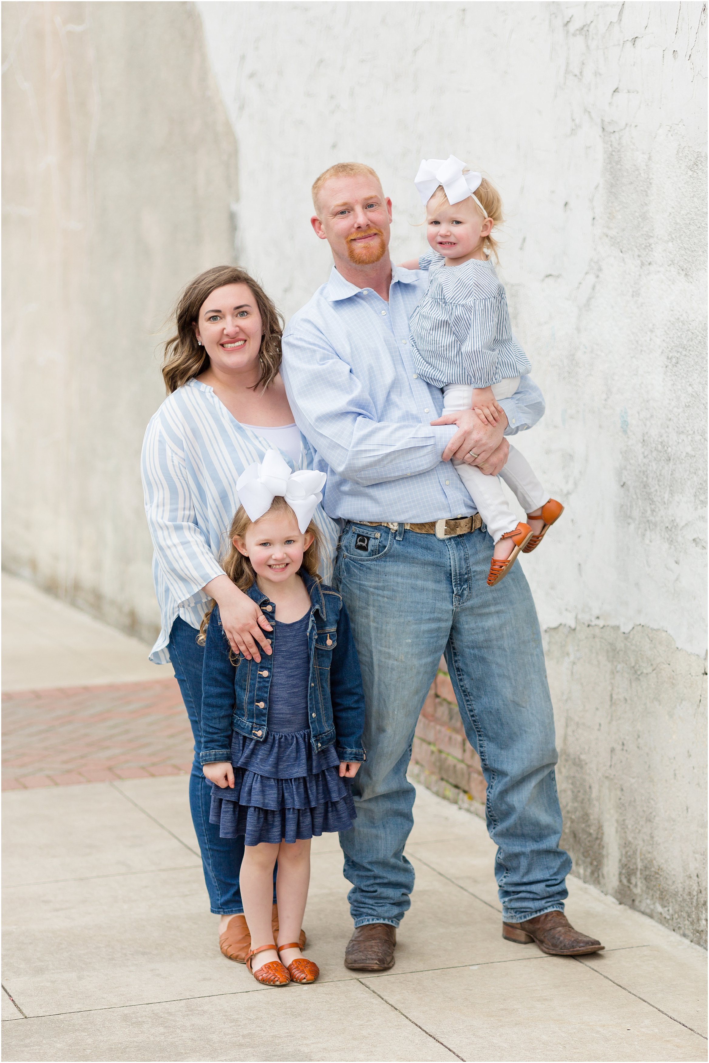 A large extended family session in Historic Downtown McKinney Square by McKinney Family Photographer Rebecca Rice Photography