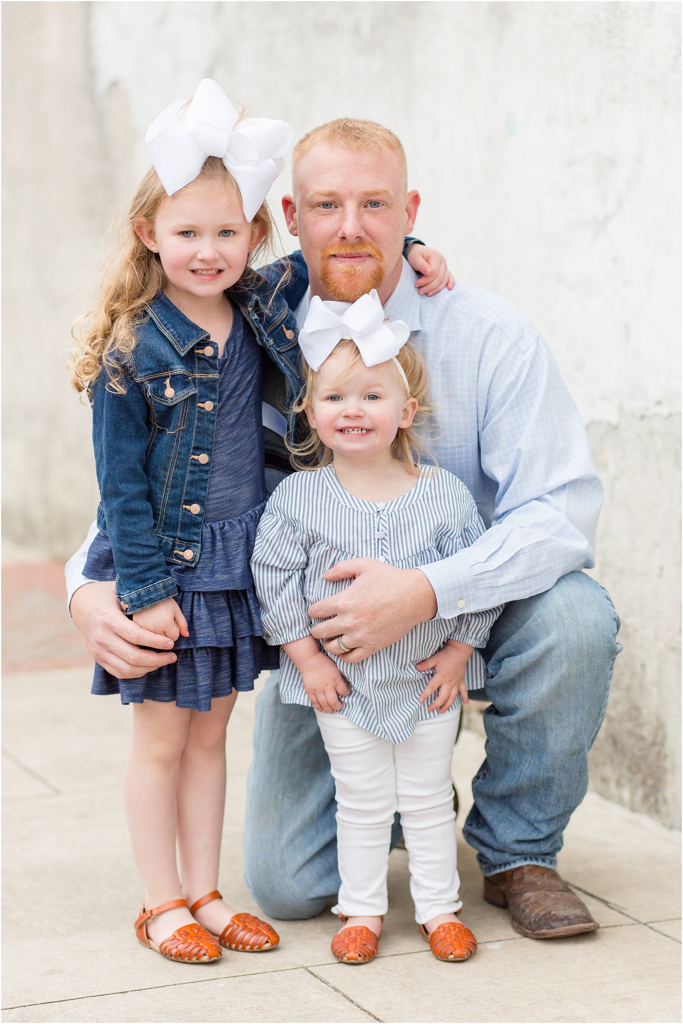 A large extended family session in Historic Downtown McKinney Square by McKinney Family Photographer Rebecca Rice Photography