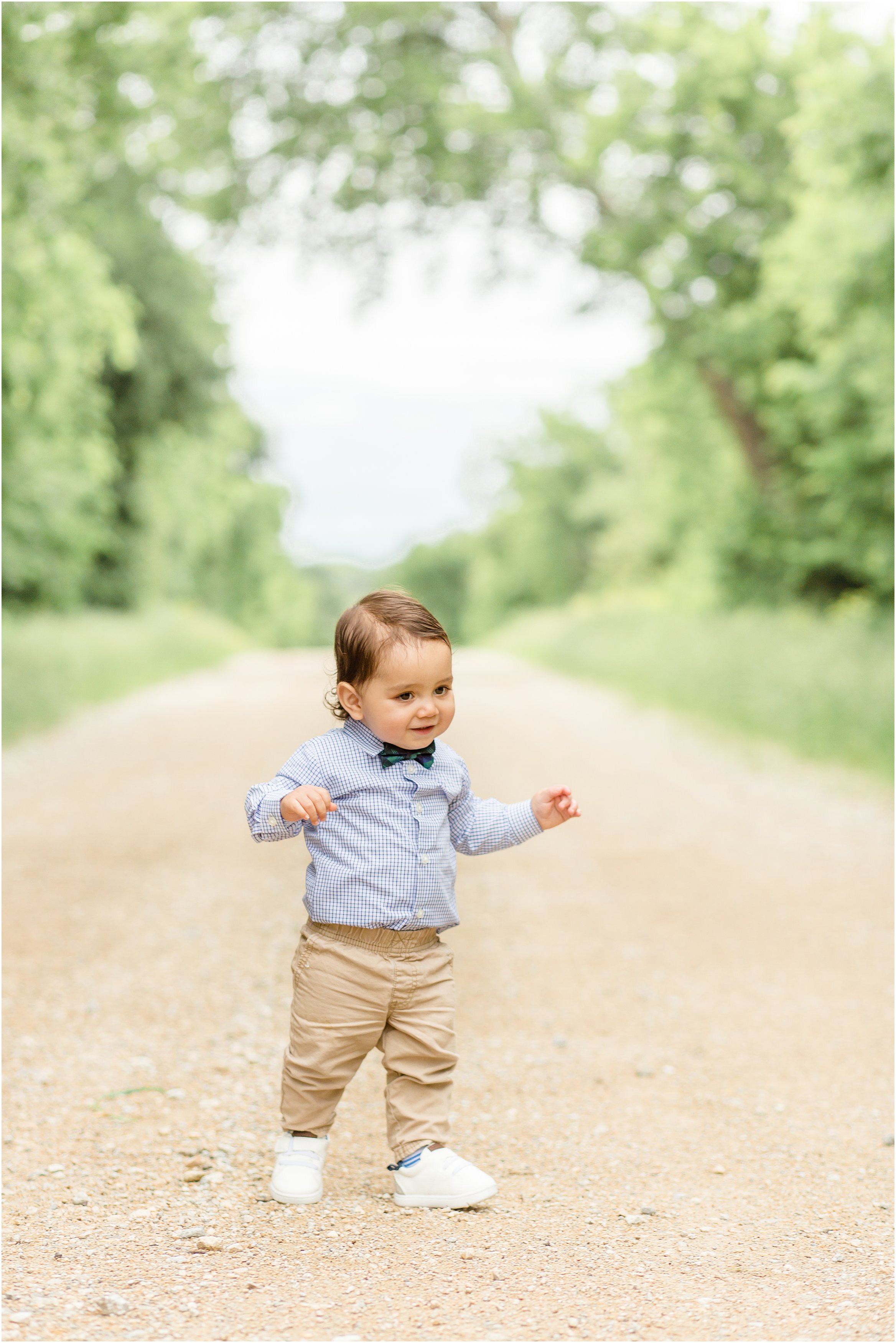 toddler walking on dirt road