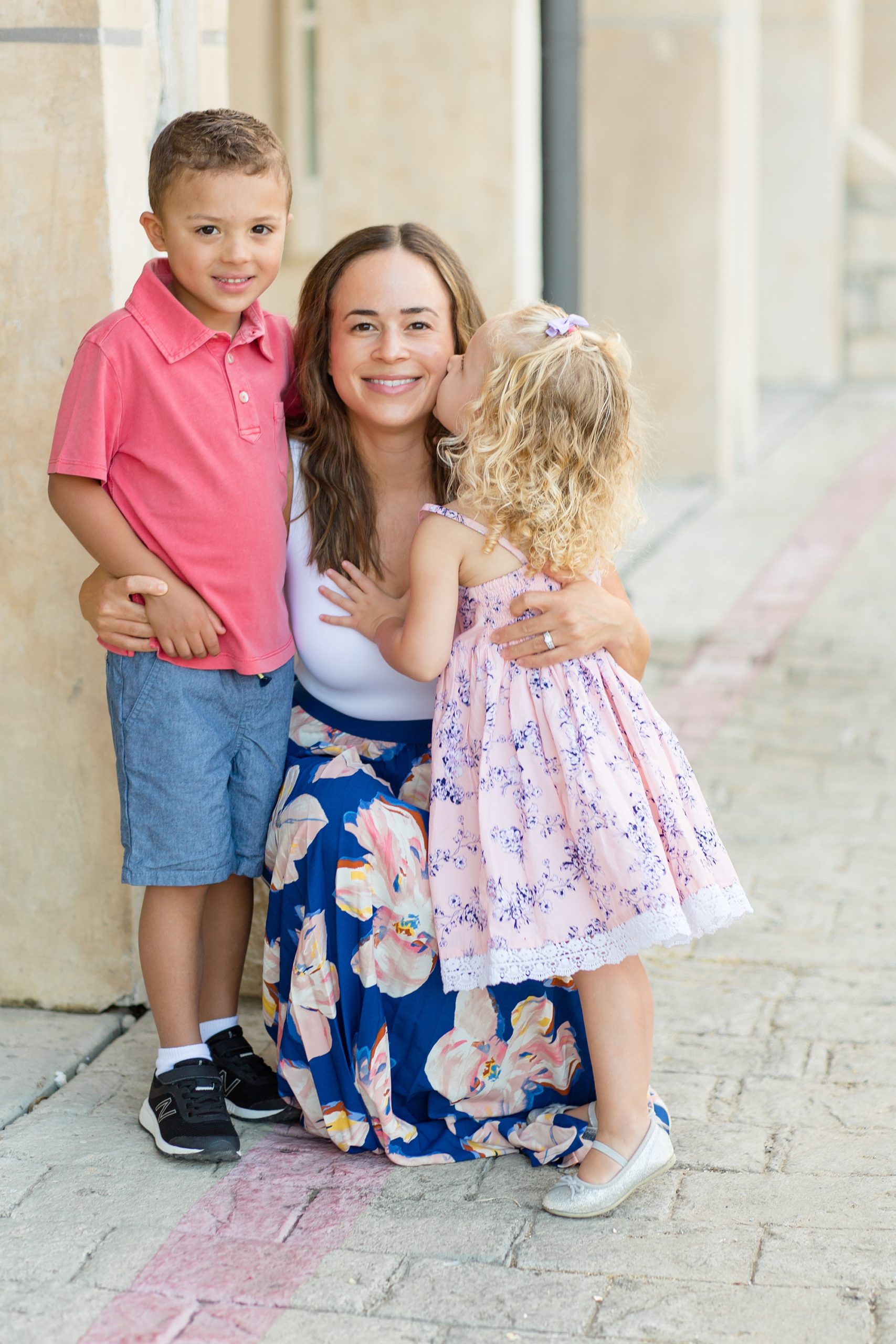 daughter kisses mom on the cheek during McKinney TX family session