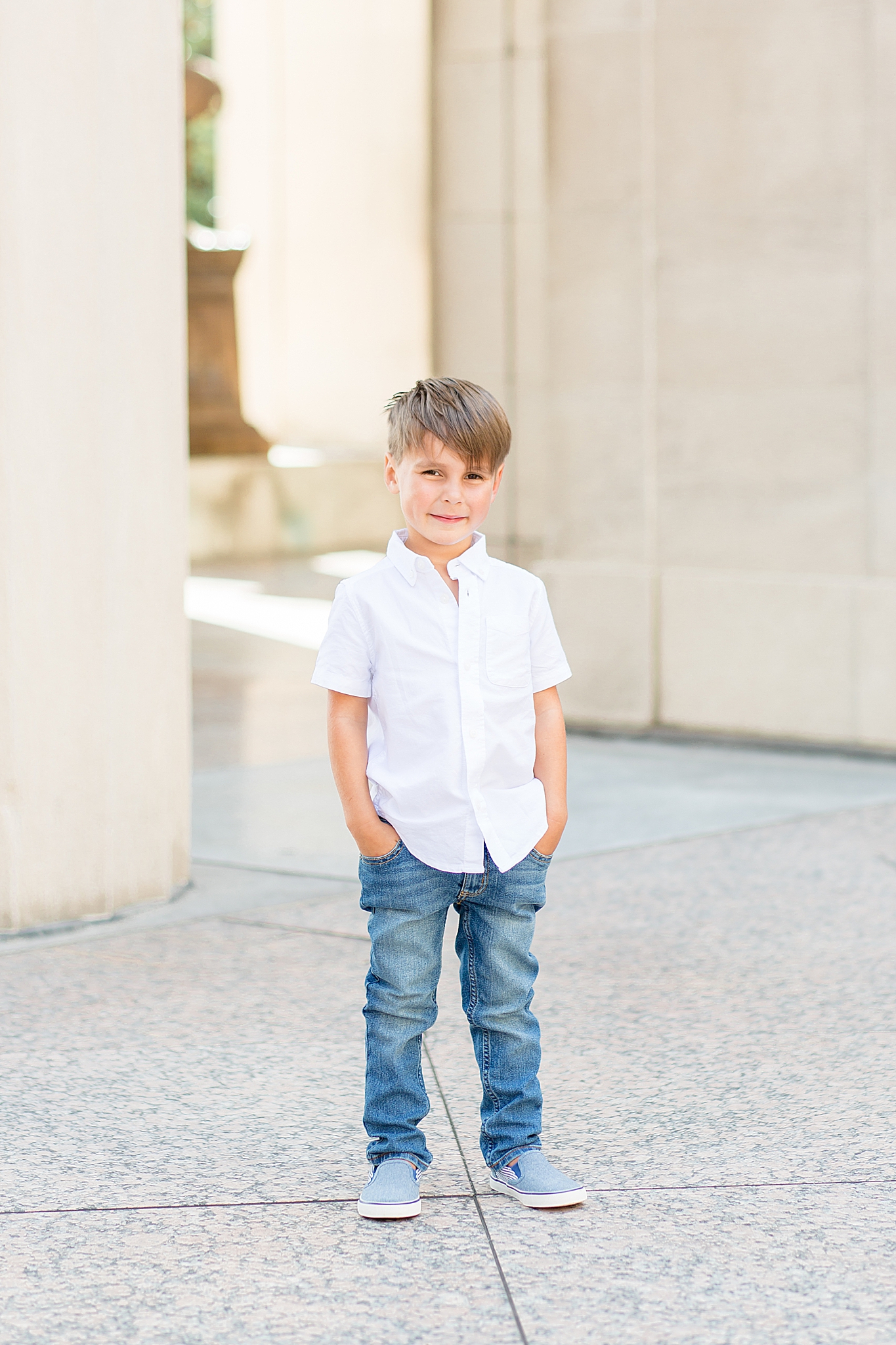 oldest son poses with hands in pockets during TN family photos