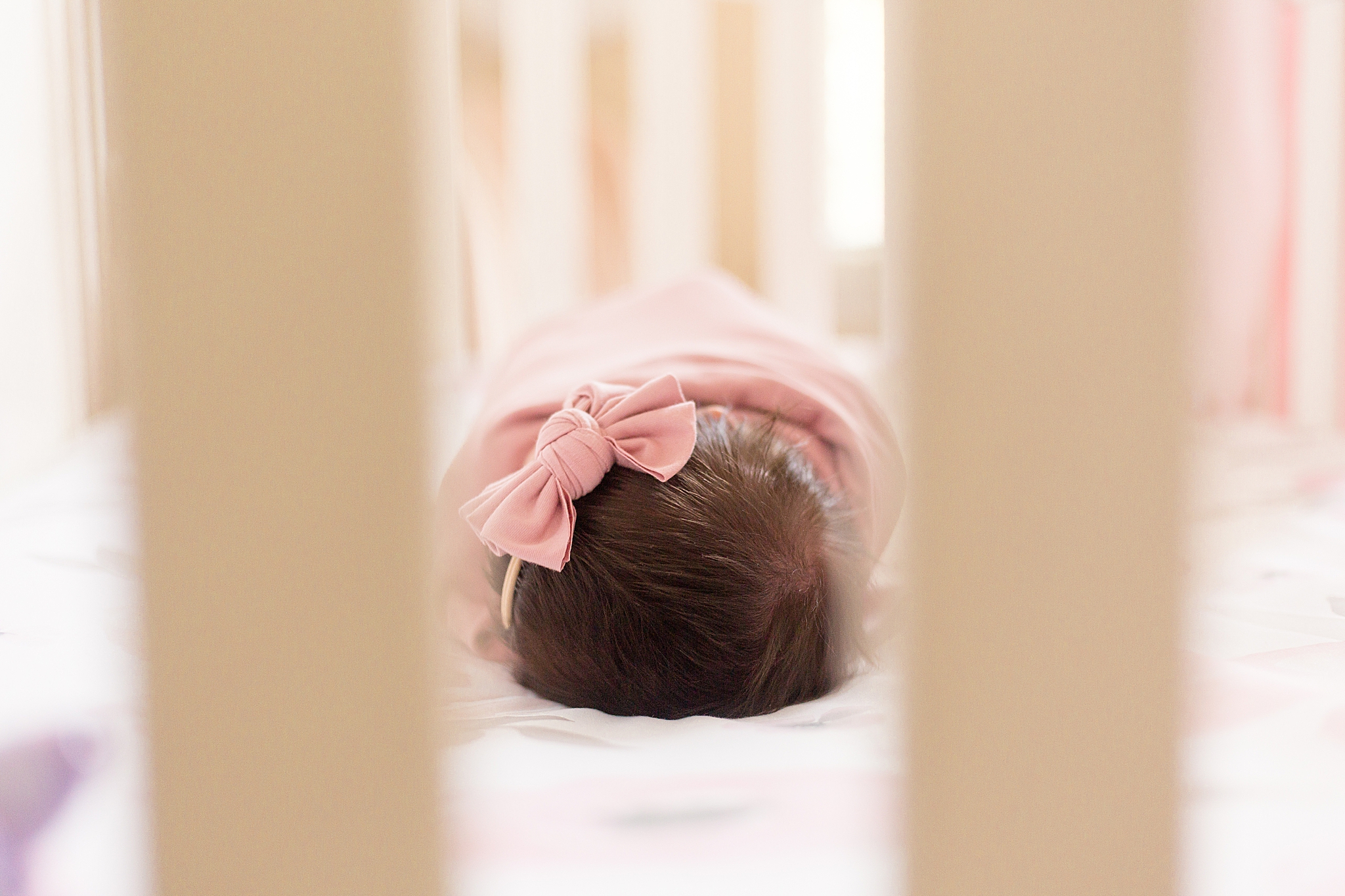 baby girl sleeps in crib during at At Home Lifestyle Newborn Session