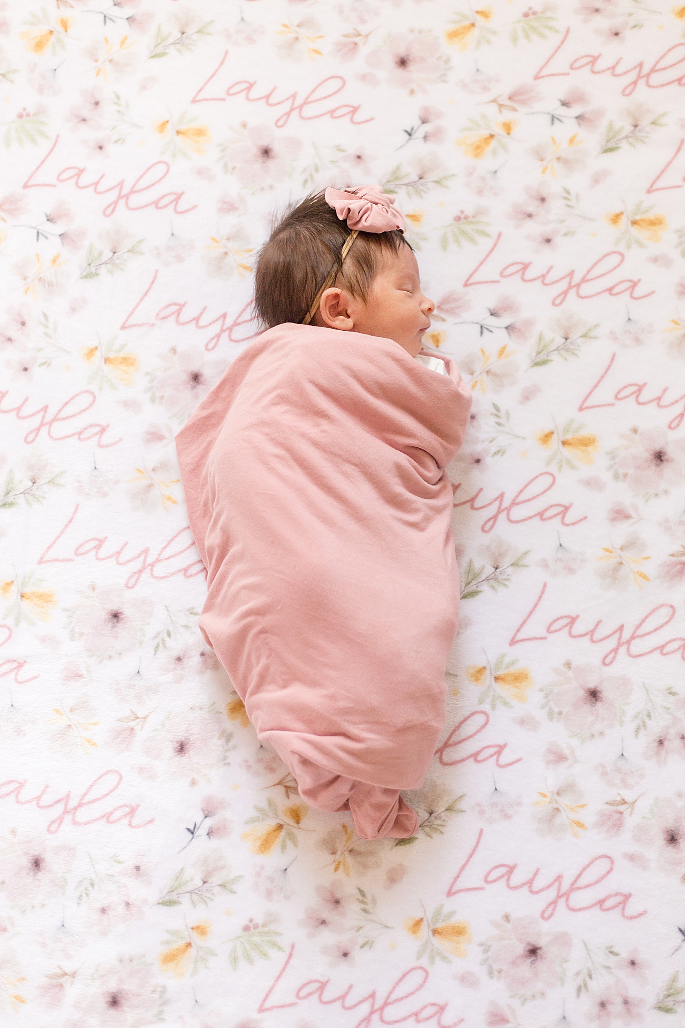 baby girl sleeps on custom sheets during lifestyle session