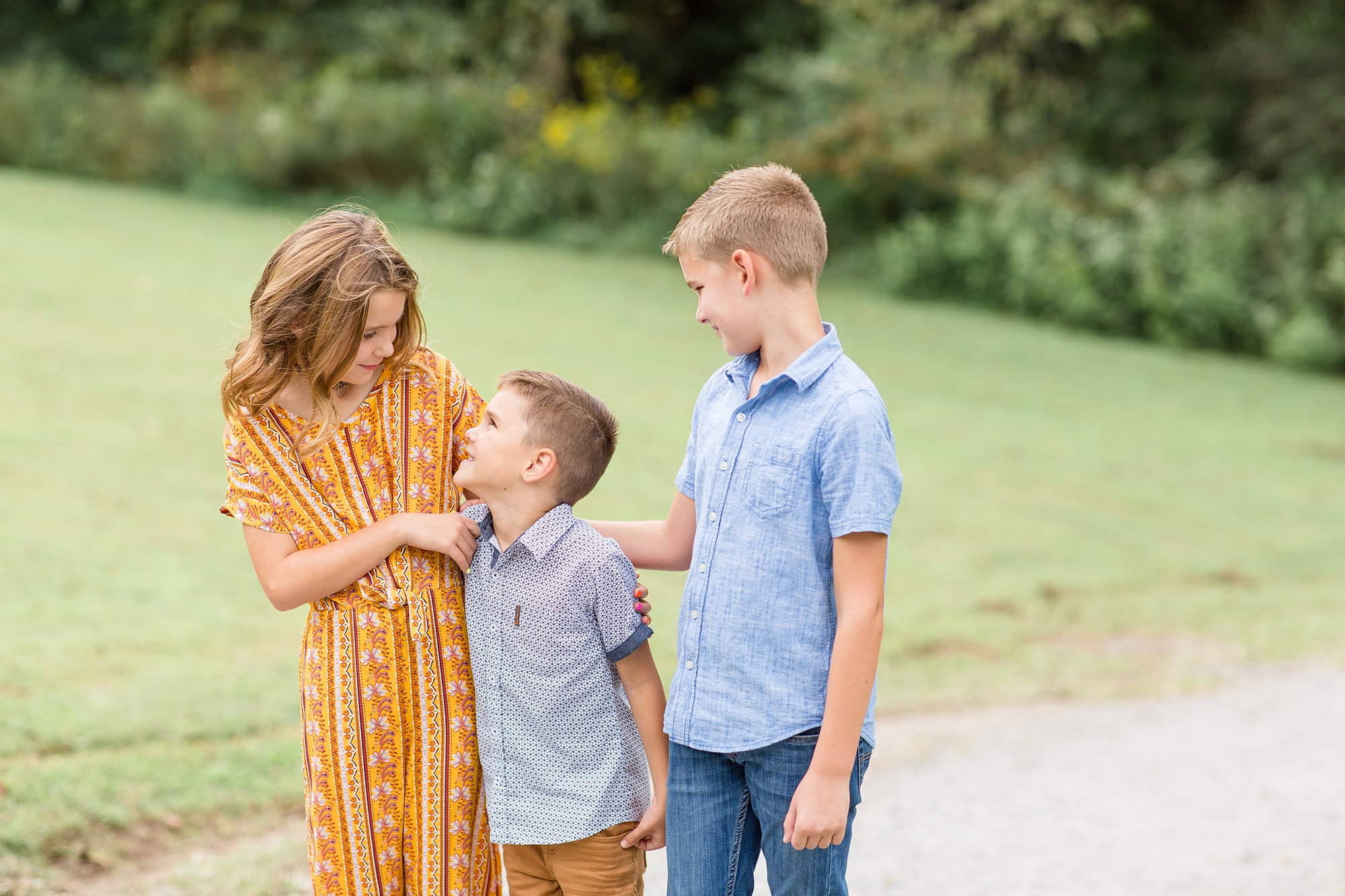 siblings look at each other during Nashville TN family photos