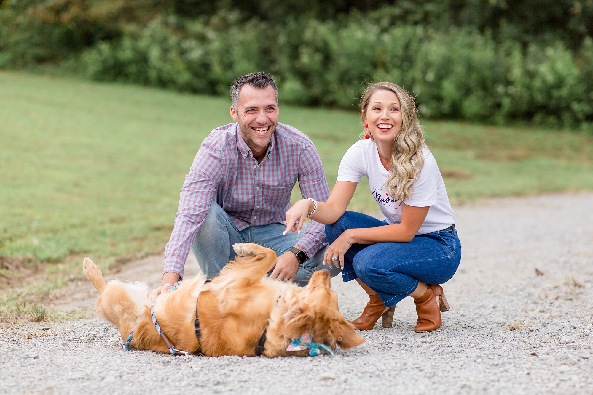 couple poses with golden retriever during Nashville TN Family Minis