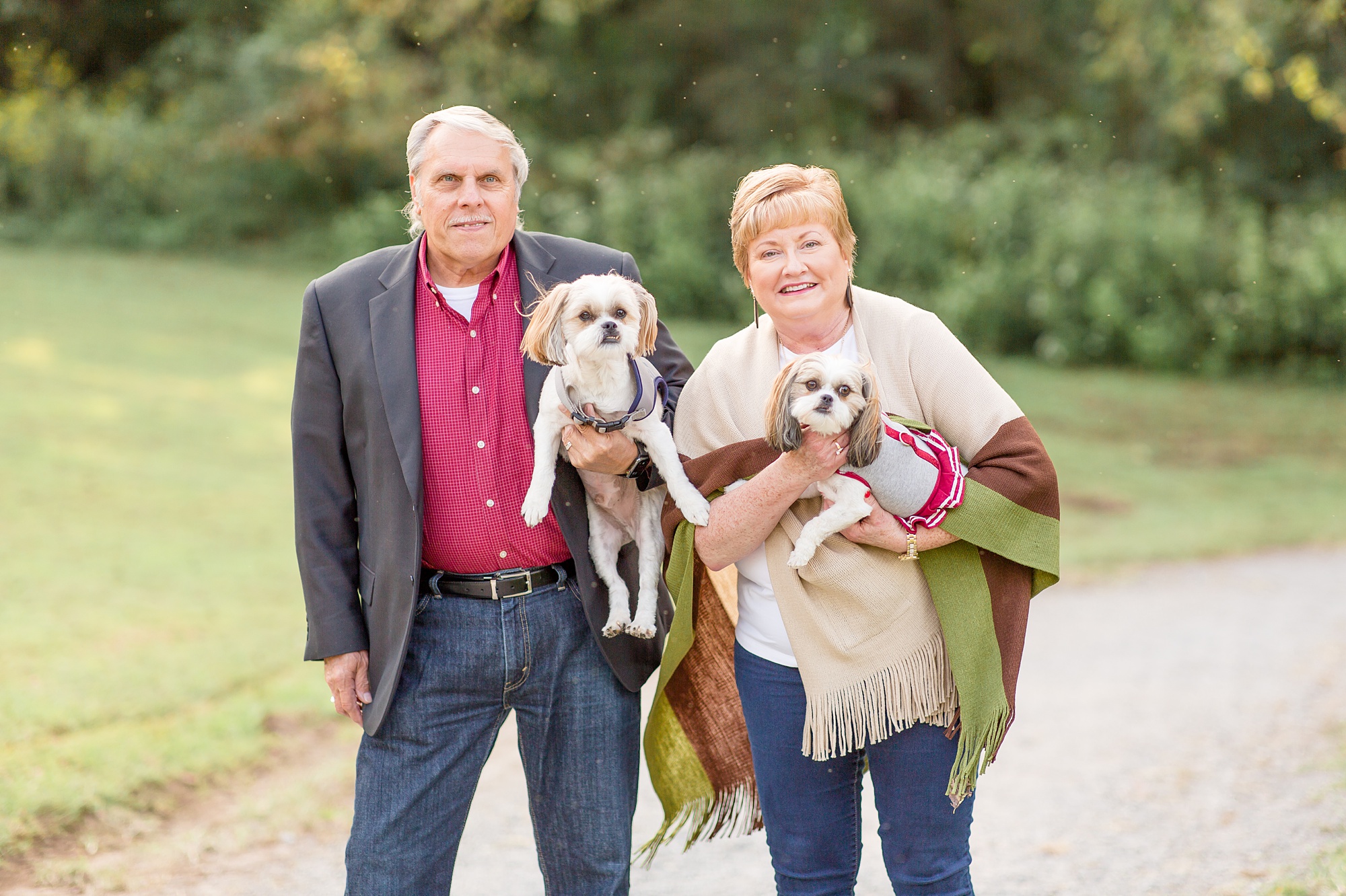couple poses with two dogs during Tennessee family portraits