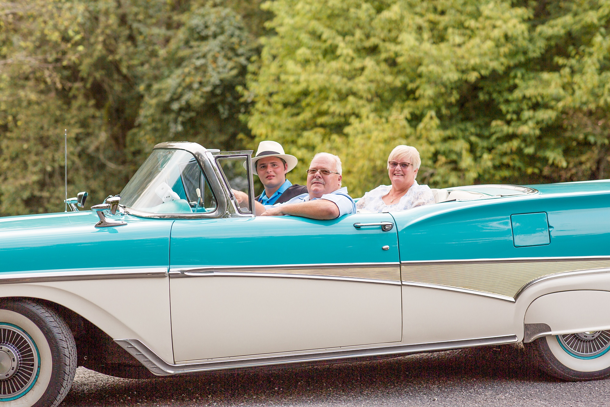 family poses with classic car during TN family photos