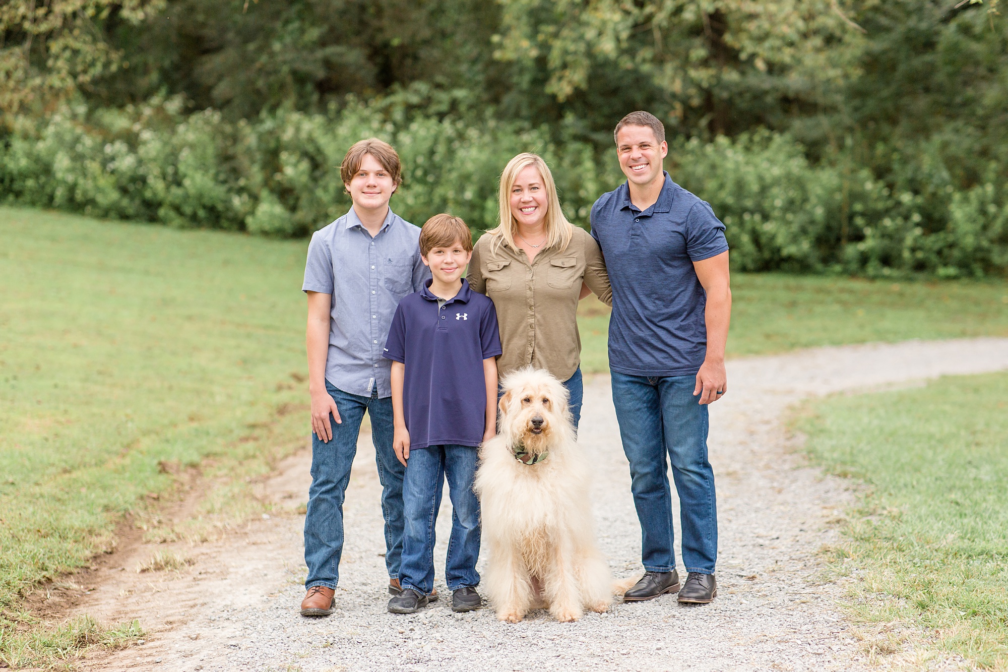 family poses with dog during TN family photos