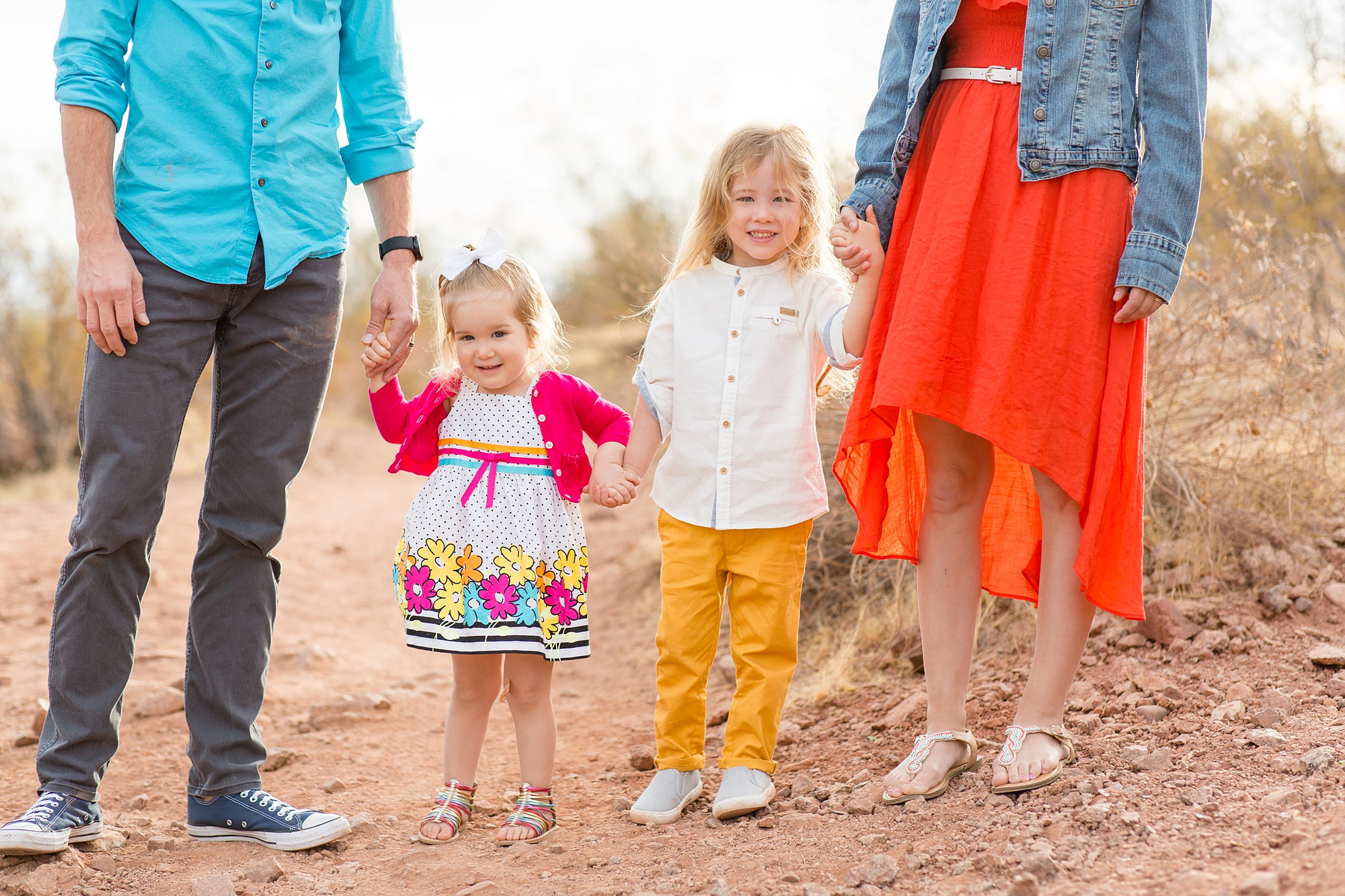 siblings hold hands during Phoenix AZ family photos