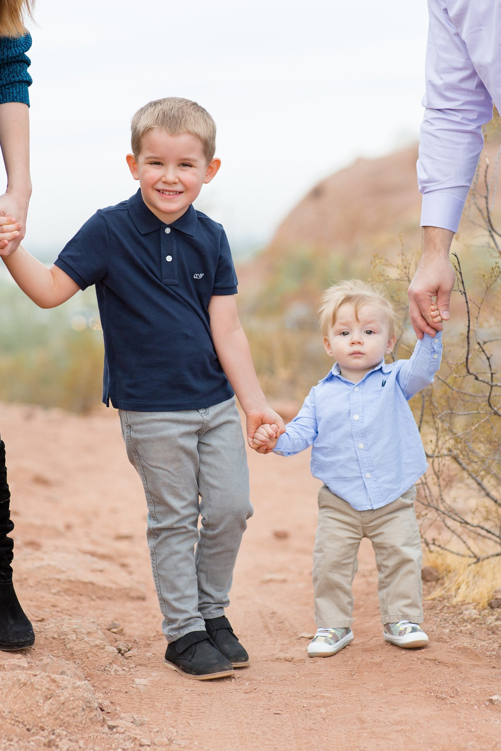 brothers hold hands during AZ family photos
