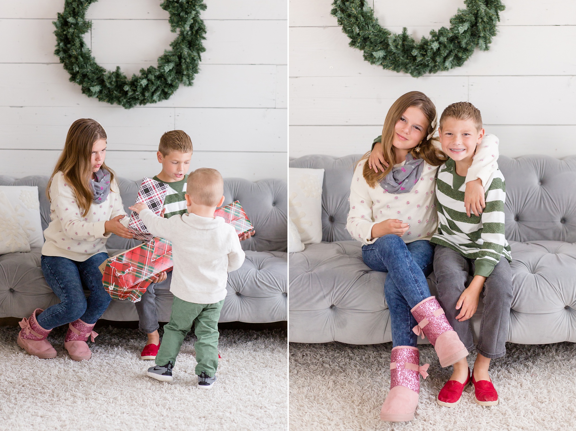 family sits on grey couch under holiday wreath