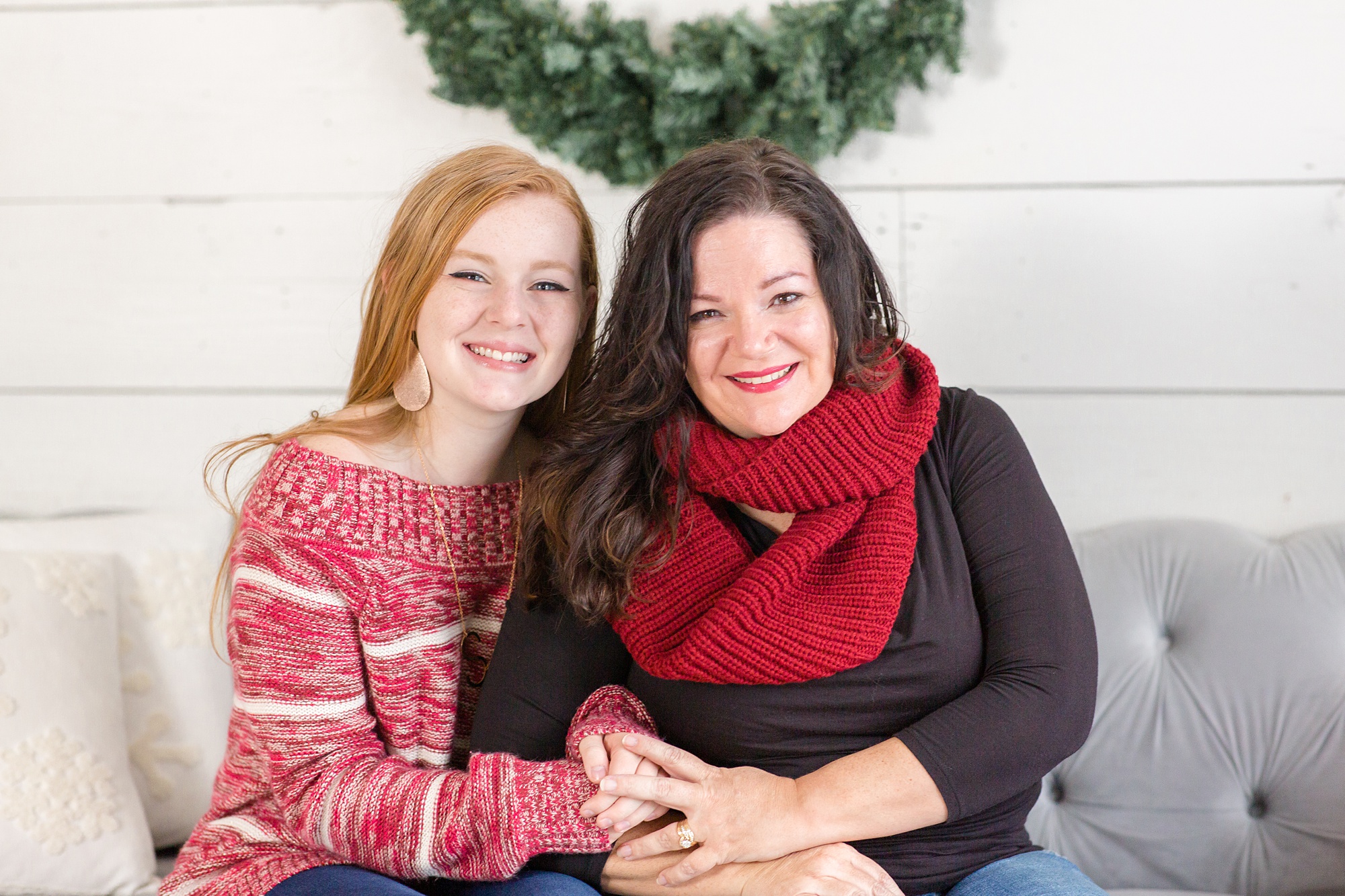 mom and daughter sit on couch during Studio House Christmas Minis