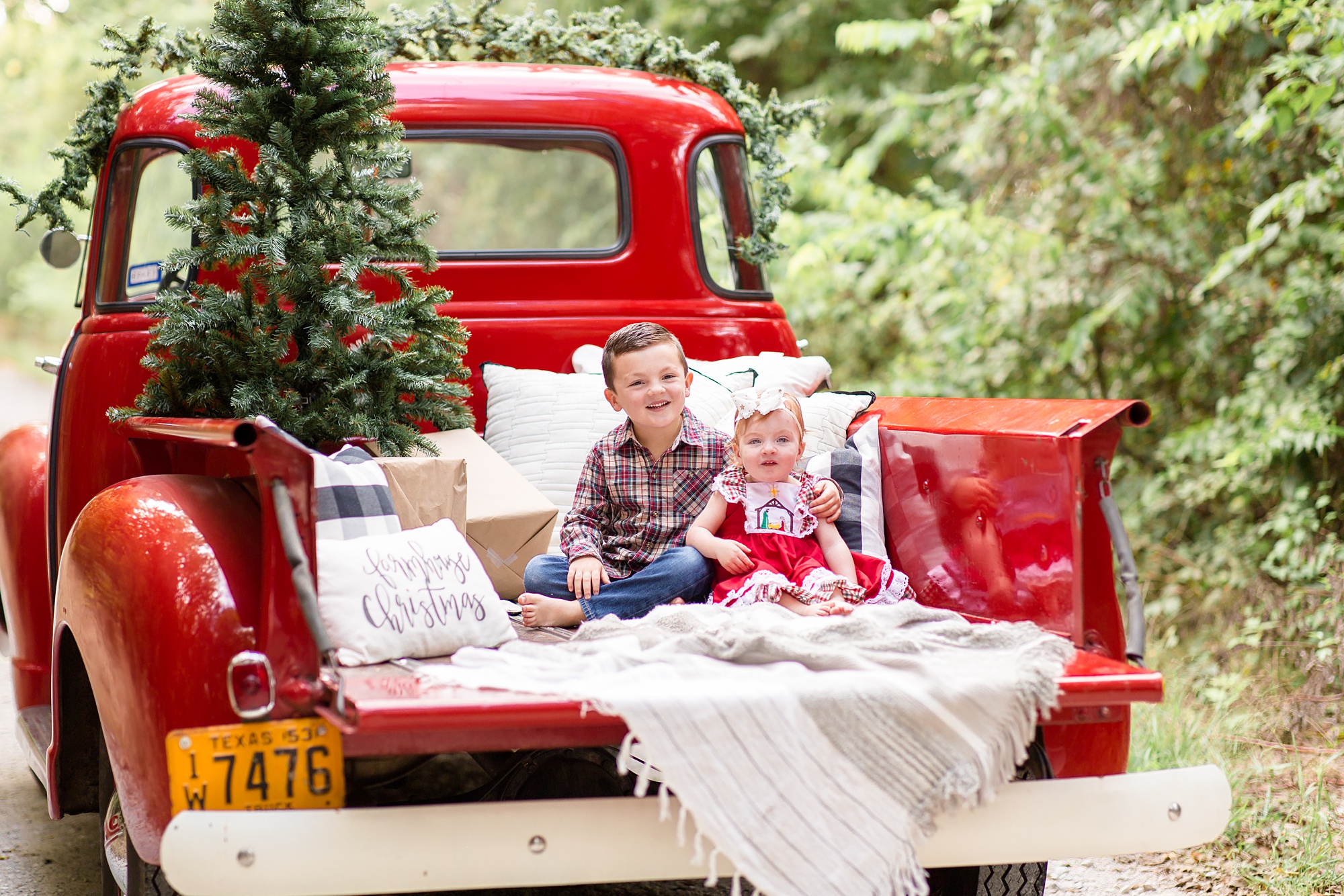 siblings rest on bed of truck during v