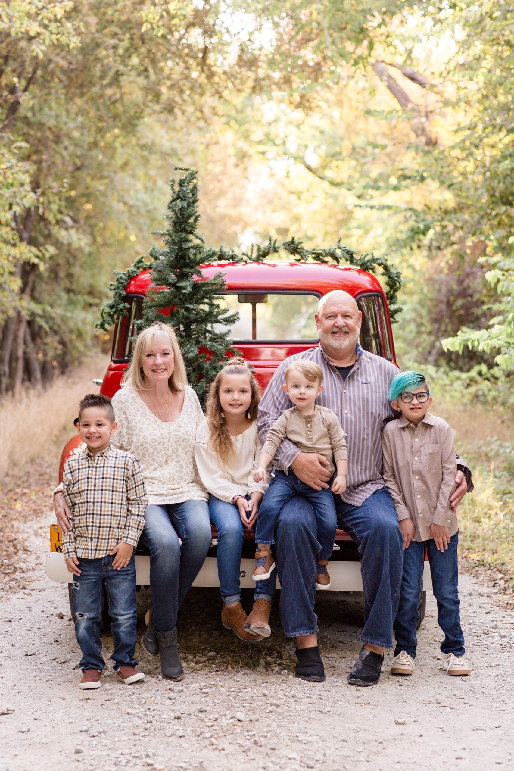 grandparents sit with grandkids during Red Truck Christmas minis