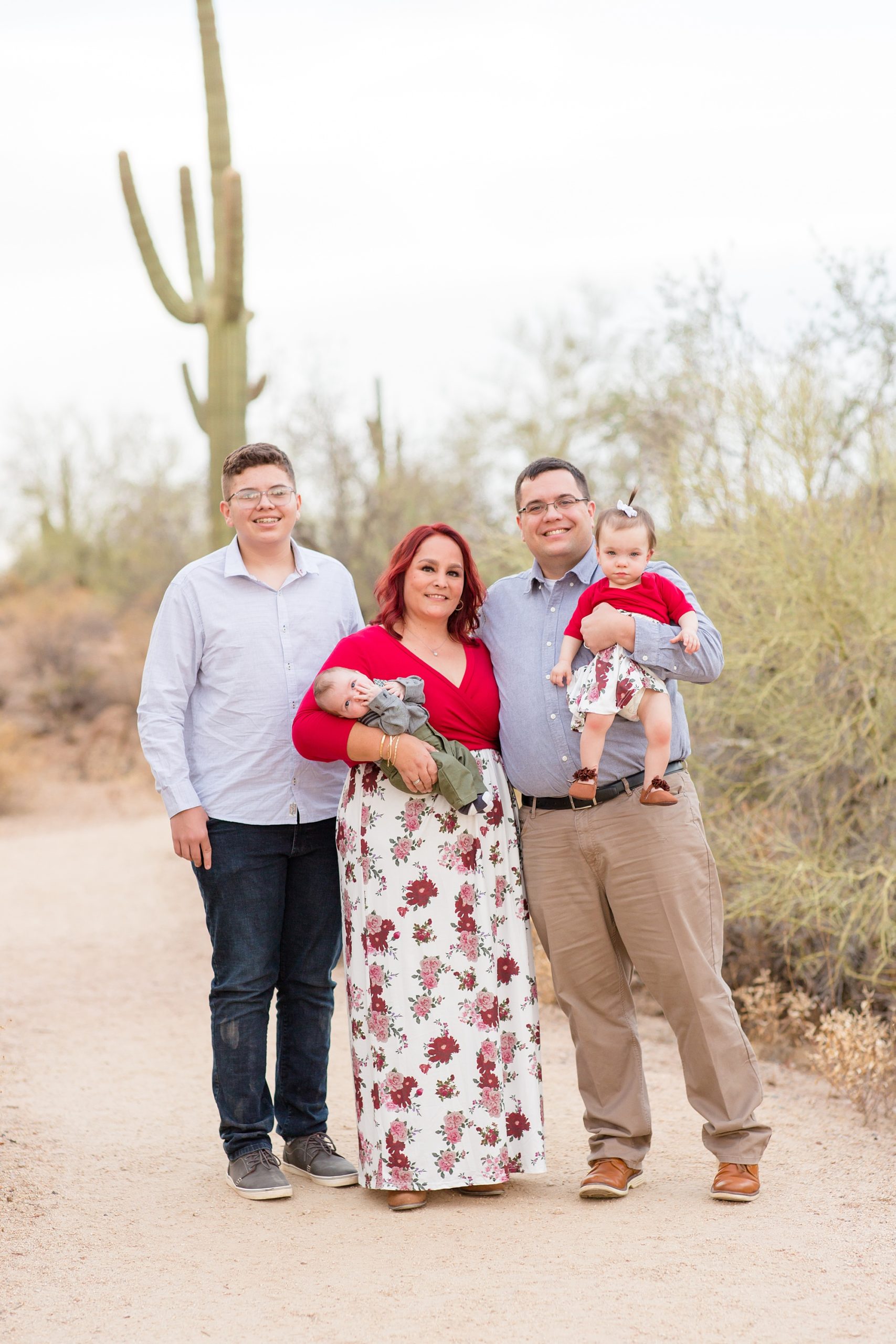 family with three kids pose during Arizona family photos