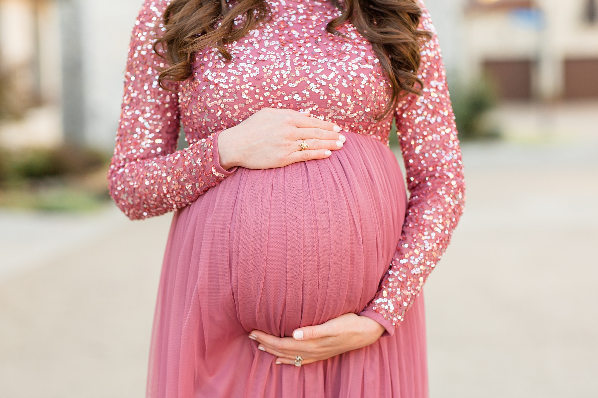 expecting mom holds belly during McKinney Maternity Session
