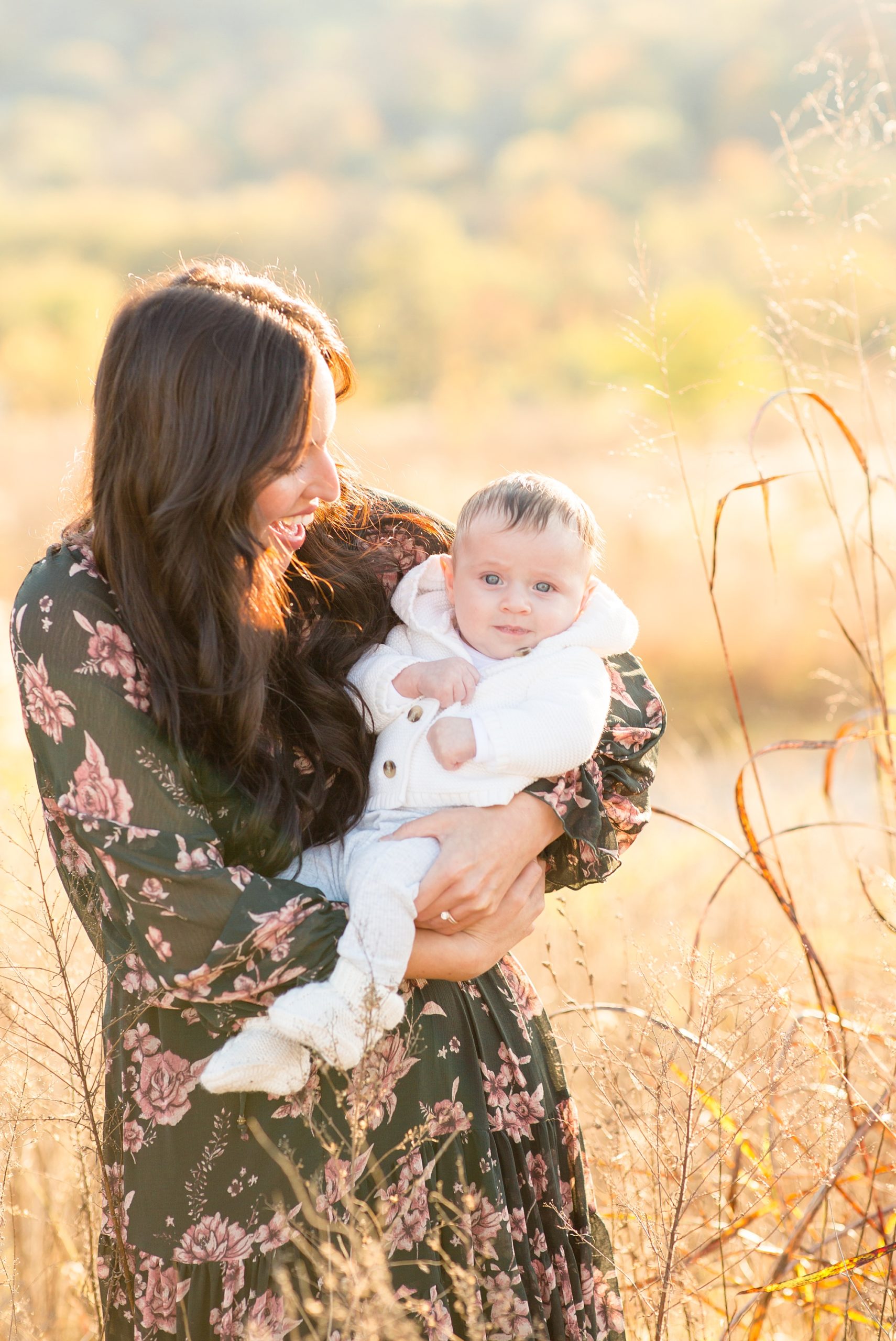 mom plays with young son during Nashville family portraits at sunset