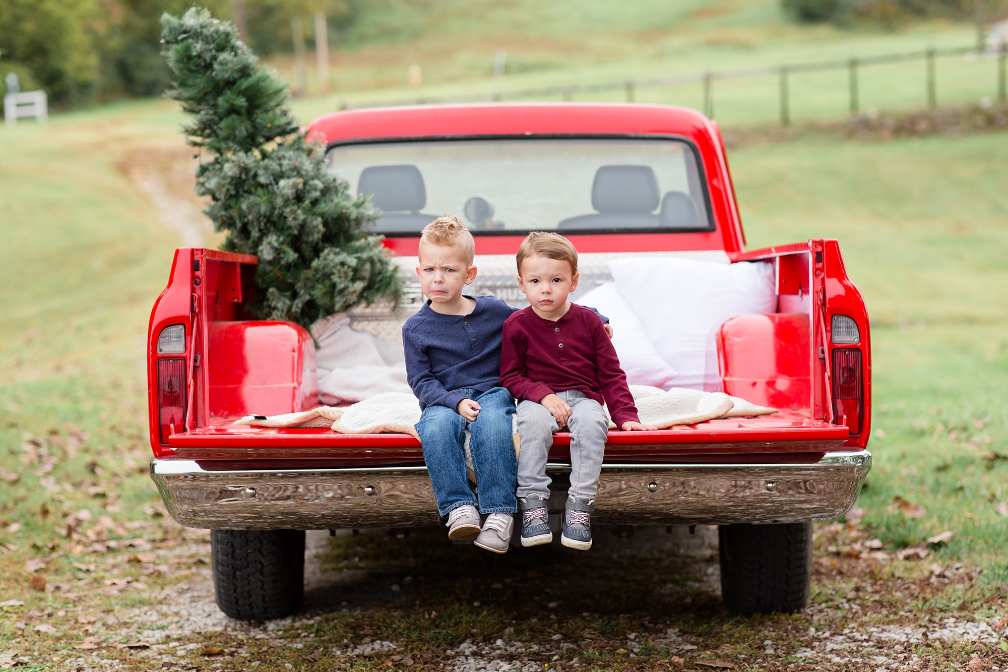 brothers sit on truck bed during TN truck minis