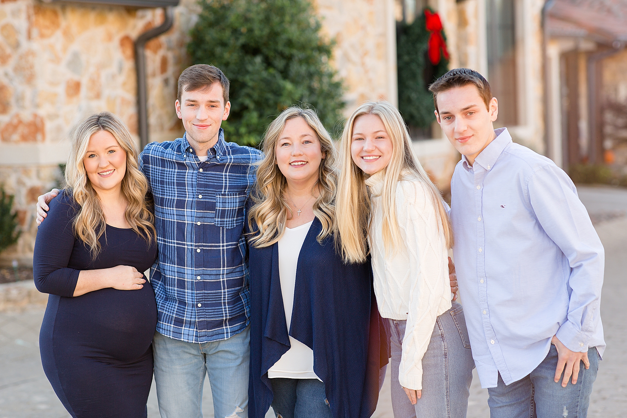 mom poses with four children during winter McKinney extended family session