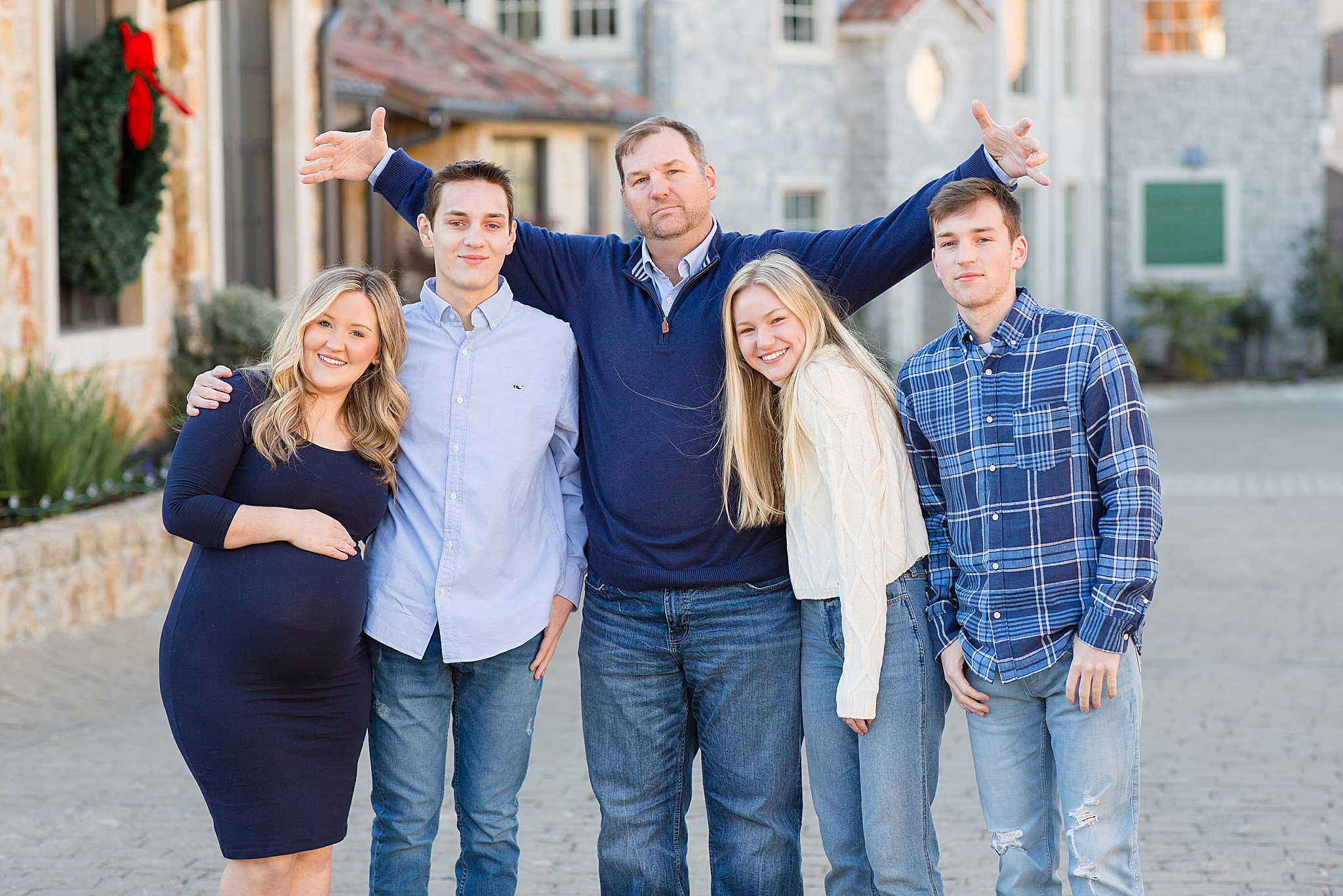 dad makes funny pose during TX family photos