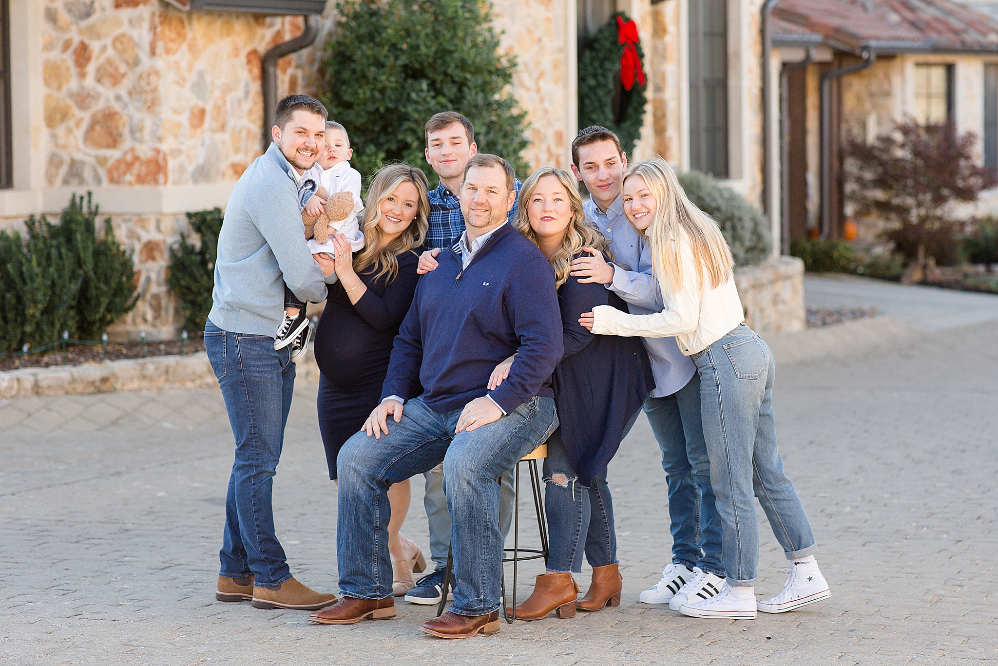 family hugs dad during McKinney extended family session