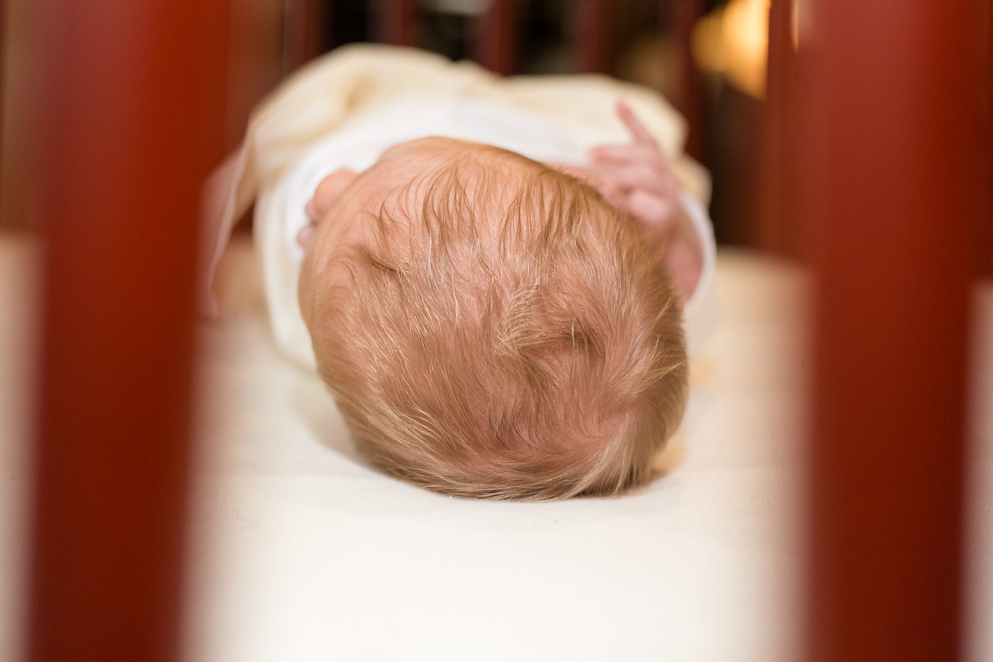 baby sleeps in crib during Nashville lifestyle newborn portraits