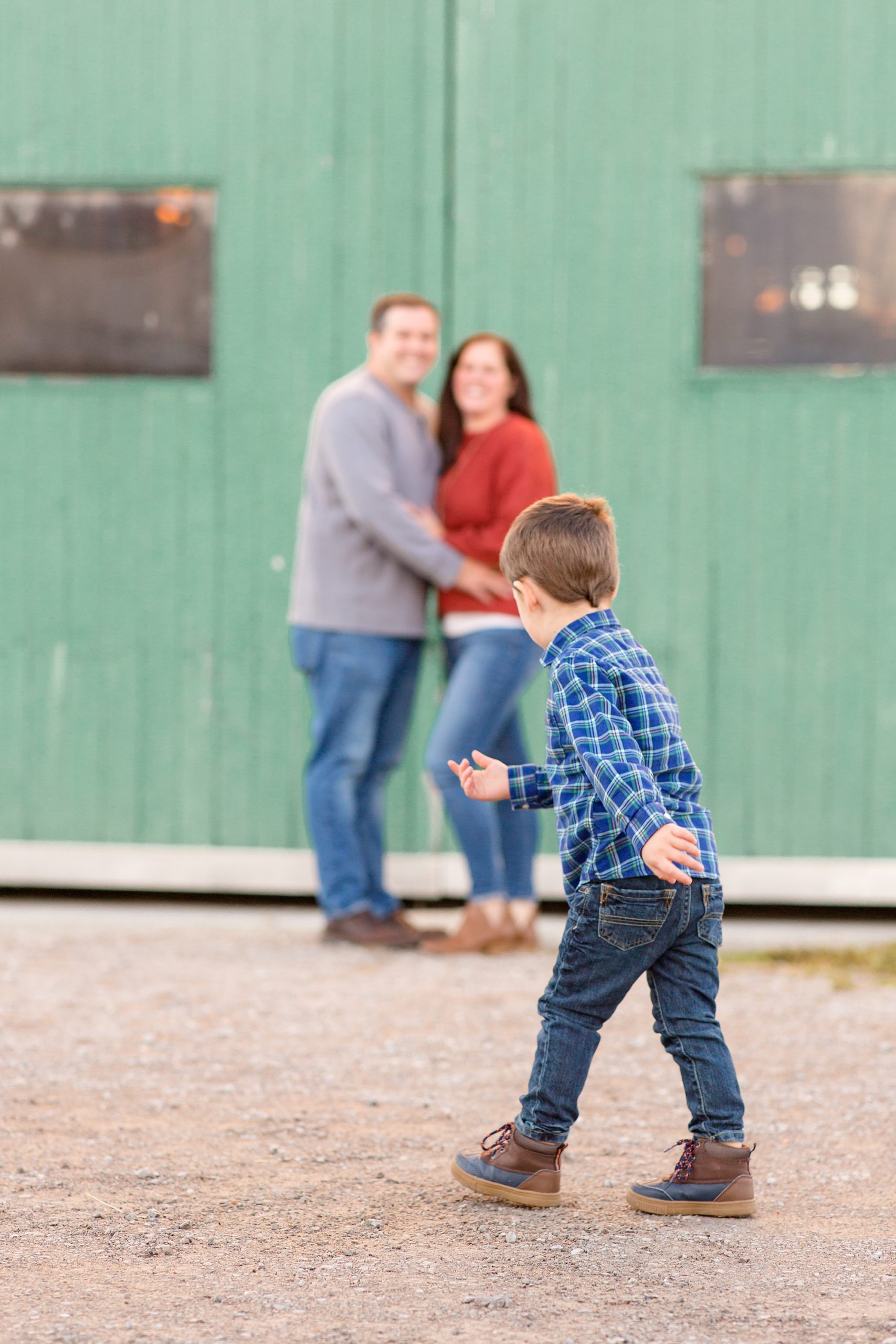 toddler runs towards parents during Harlinsdale Farm family portraits