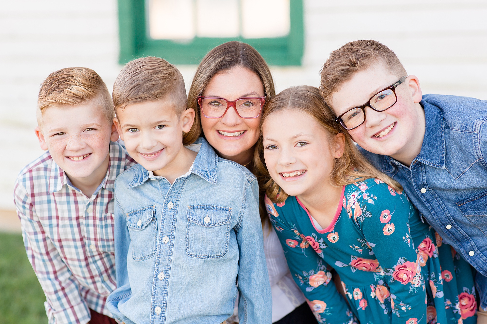 mom poses with four children during TN family photos