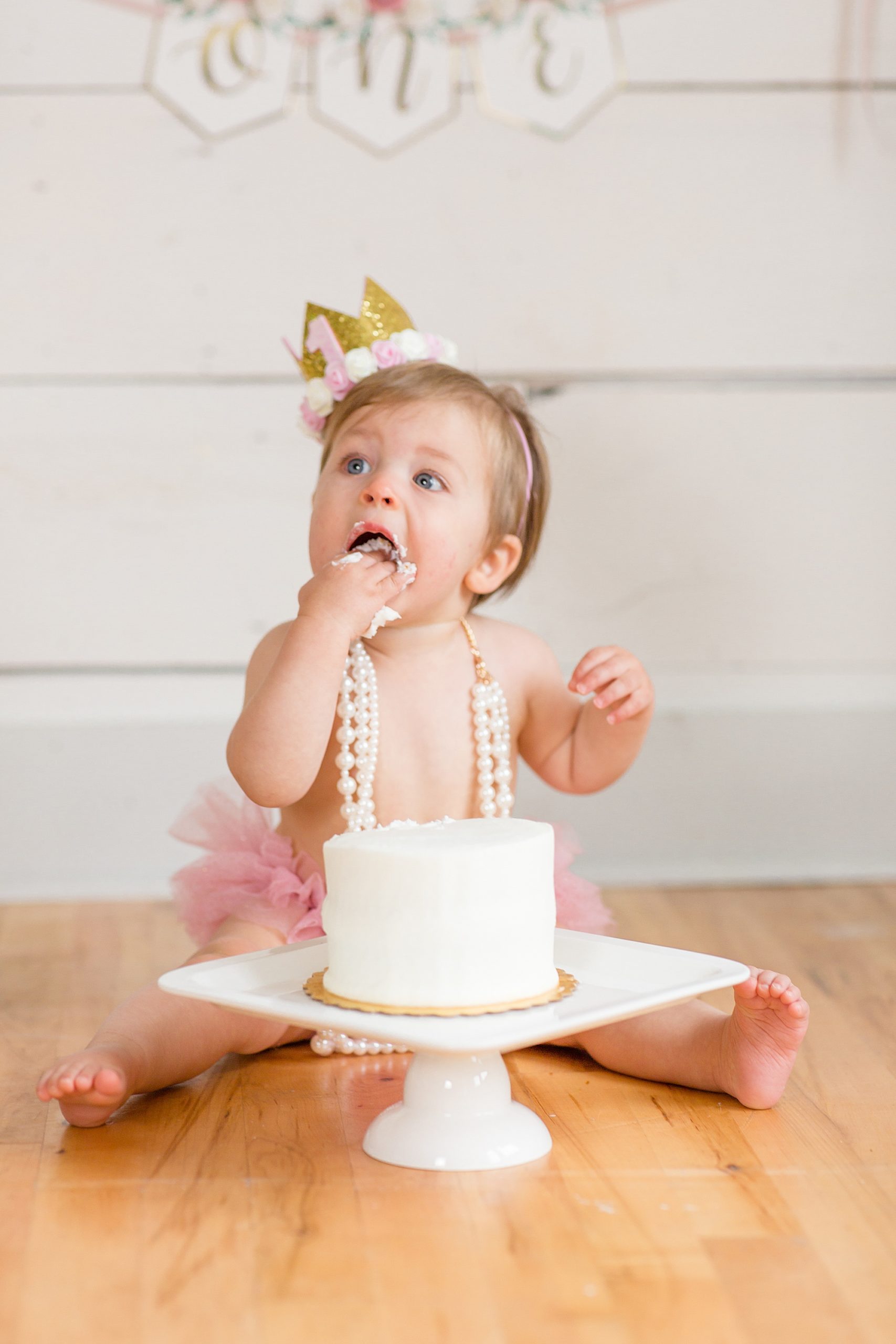 baby eats icing from cake during Texas cake smash