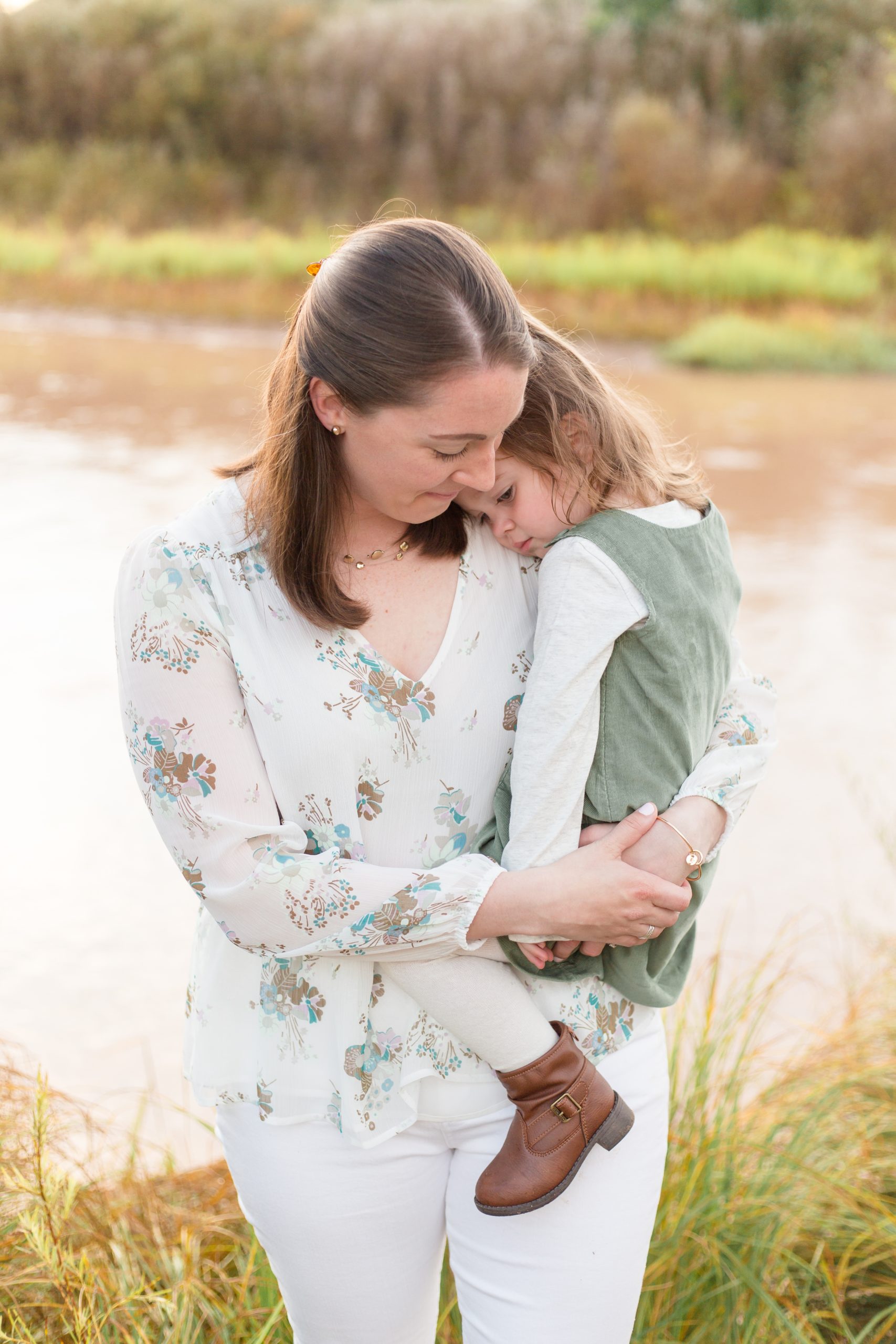 daughter hugs mom during family portrait session in New Mexico with Rebecca Rice Photogrpahy