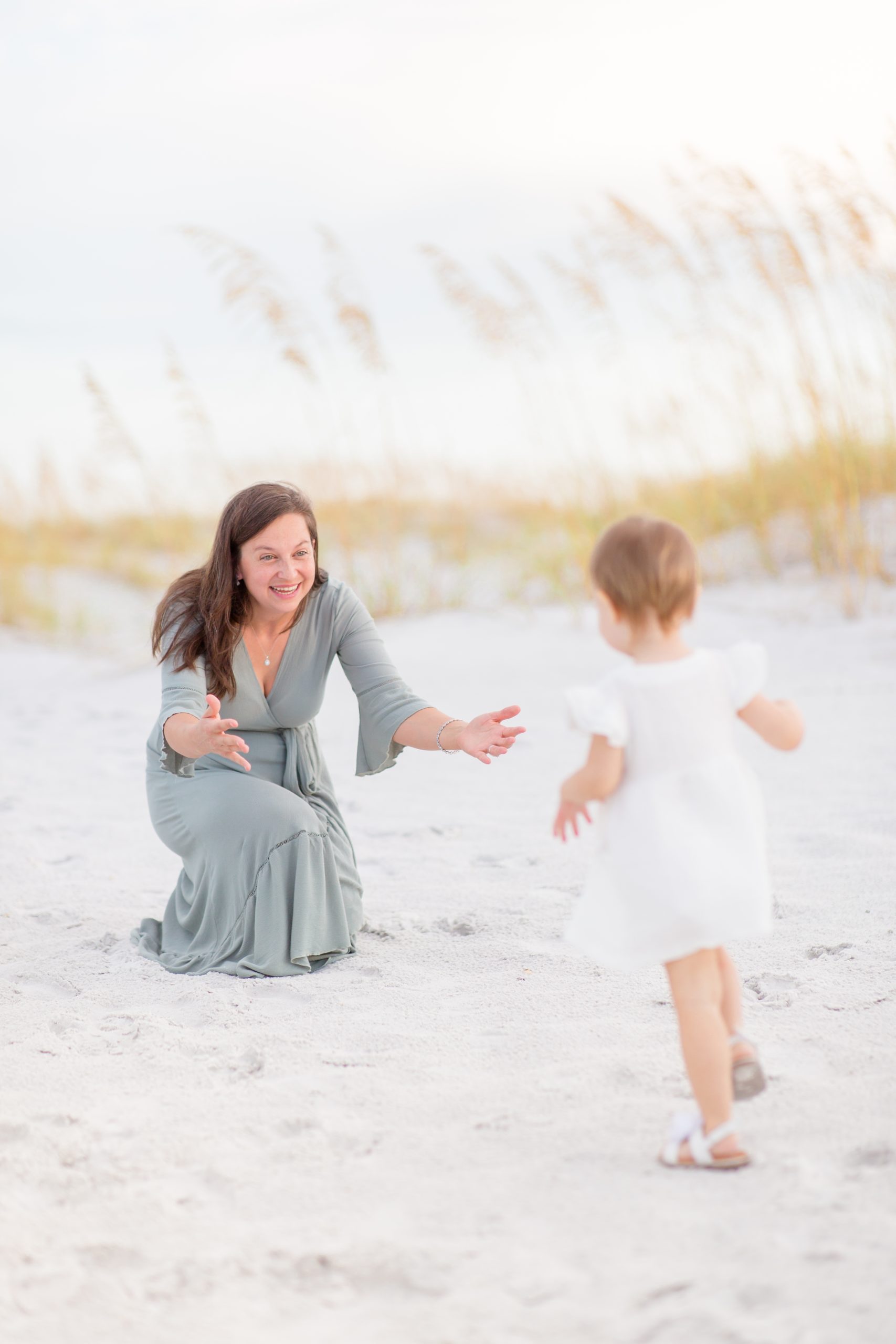 Mom and daughter pose during portrait session on Anna Maria Island in Florida with family photographer, Rebecca Rice Photography. Click to see more from this portrait session on the blog now! 