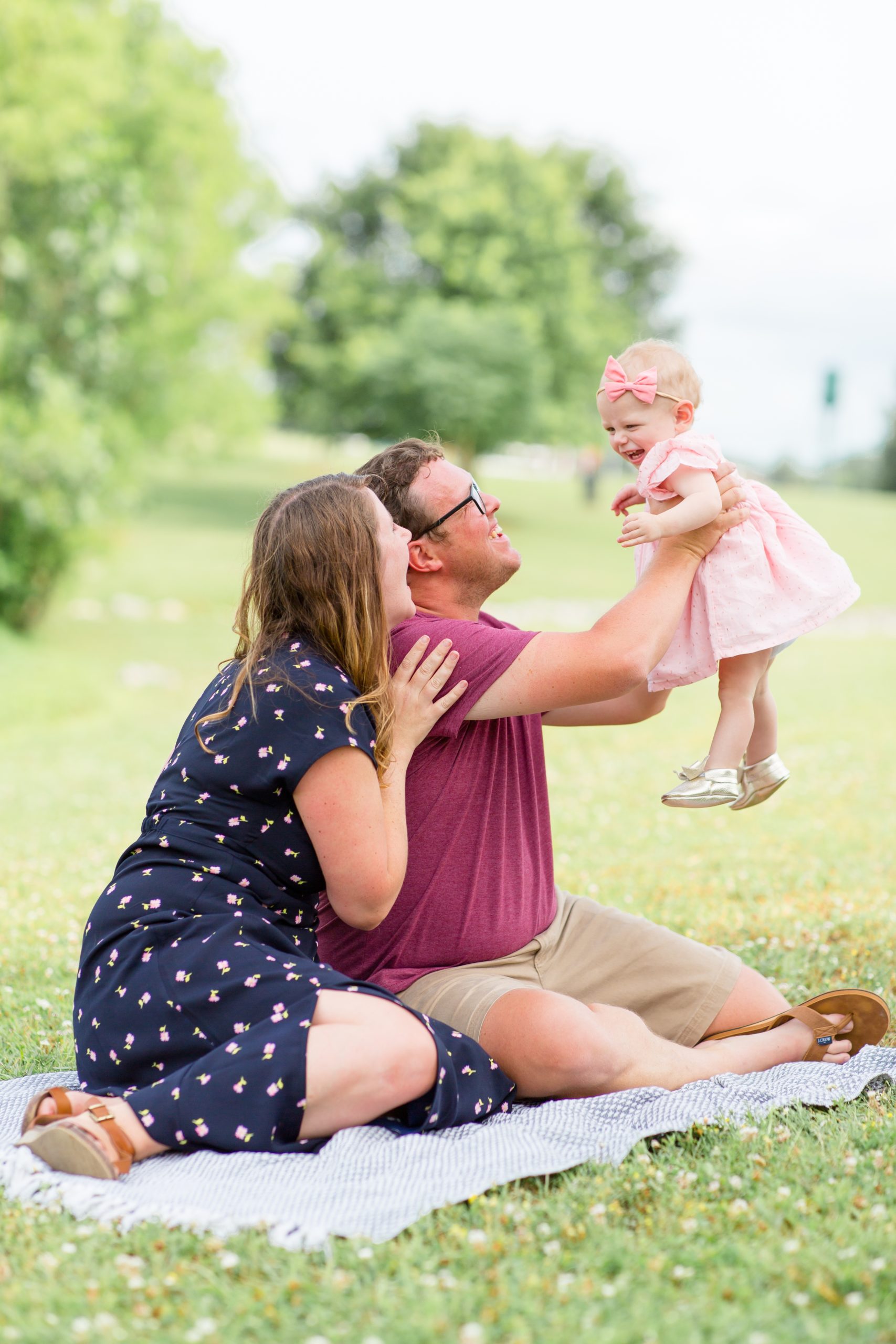 Family of 3 poses for quick shot during daughter's first birthday session at Harlinsdale Farm in Franklin, TN with Rebecca Rice Photography. Click to see more from this sweet session on the blog now! 