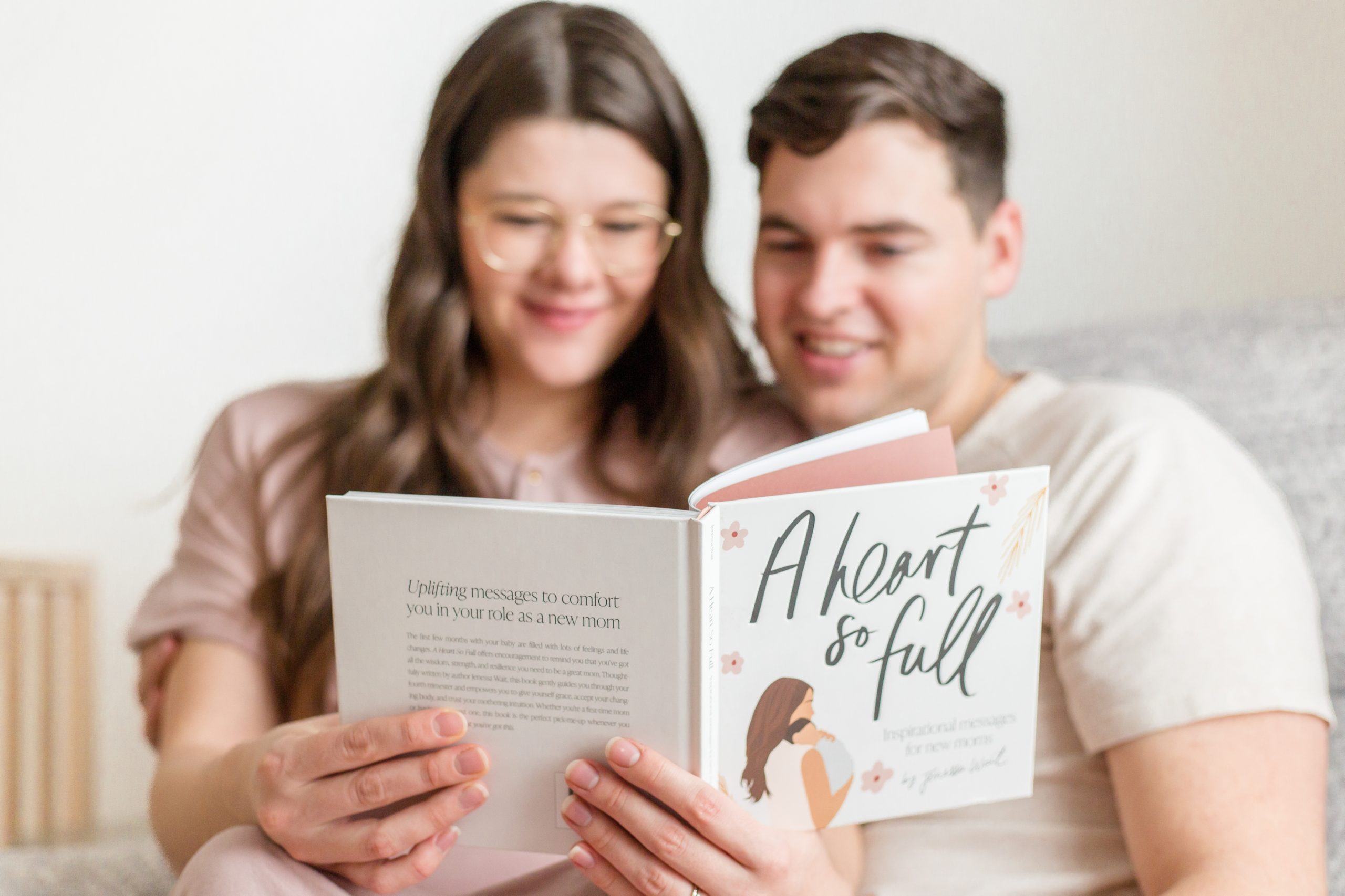 Parents read "A Heart So Full" during lifestyle maternity session with family photographer and educator Rebecca Rice of Rebecca Rice Photography. Click to see more from this sweet session live on the blog now! 