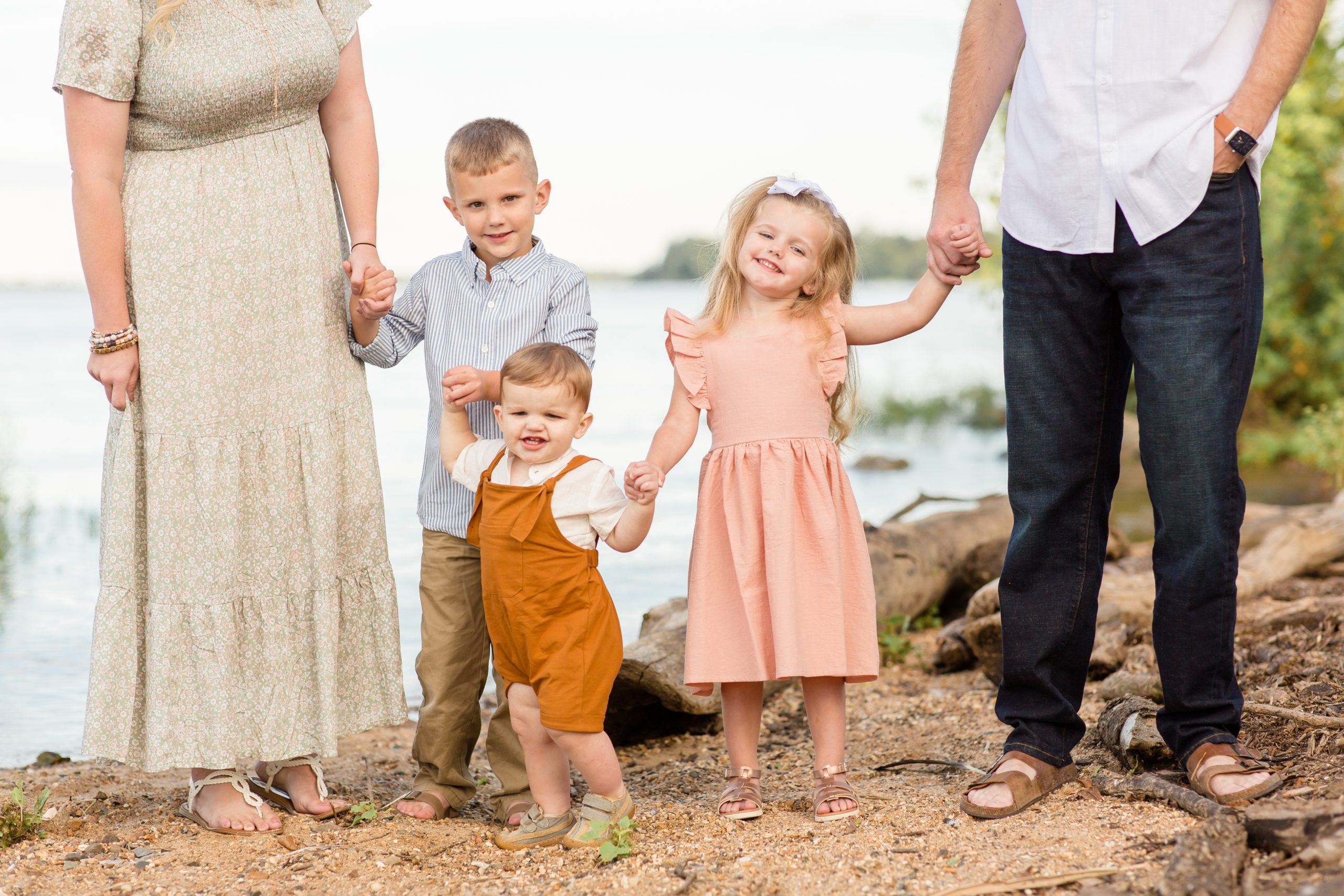 Family of 5 poses in front of James River during family portrait session in the fall with family photographer and educator Rebecca Rice Photography. Click to see more from this session live on the blog now!