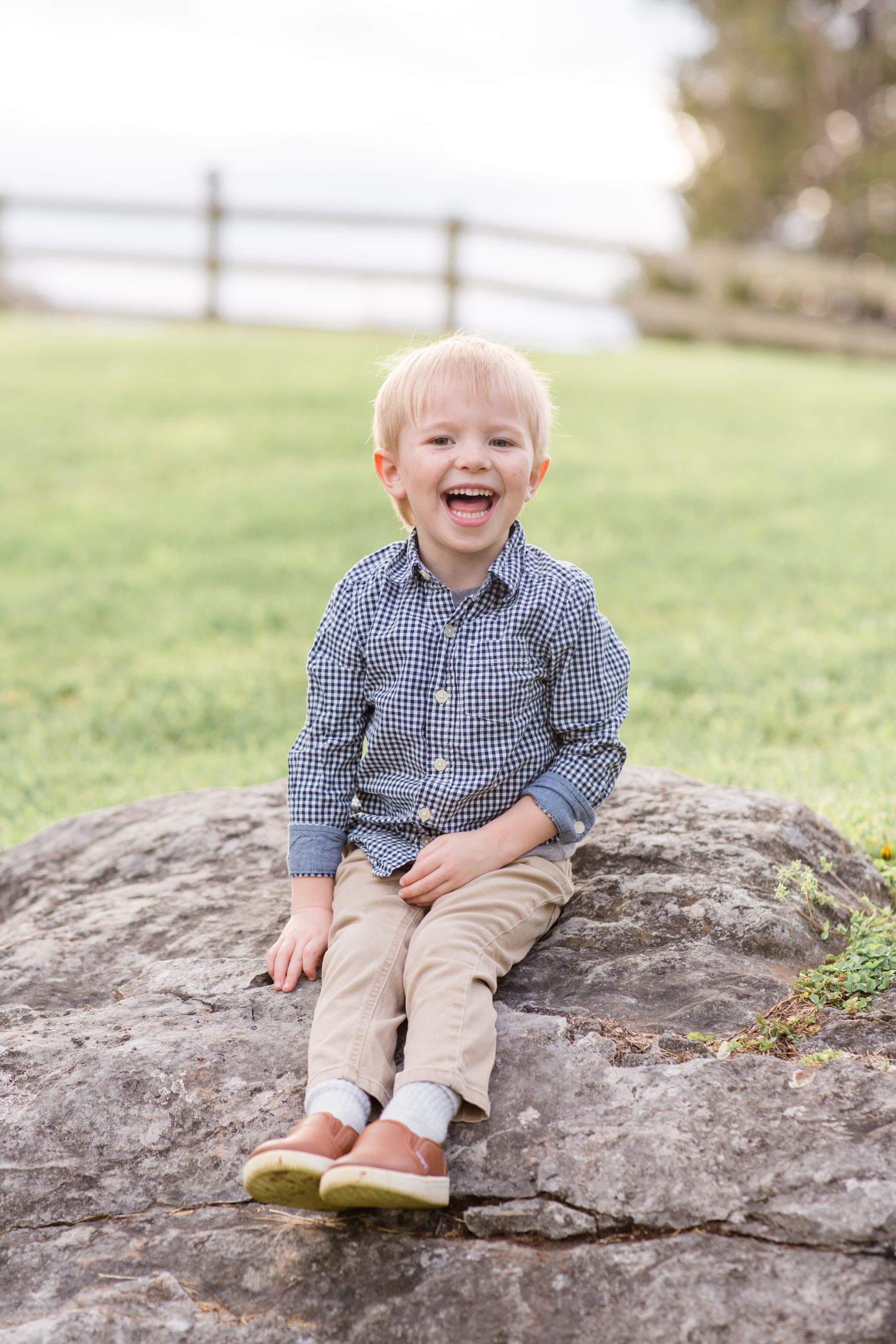 Boy in button up and khakis poses on rock during mountainside maternity + family session in Lexington, VA with family photographer and educator Rebecca Rice Photography. Click to see more from this precious session live on the blog now! 