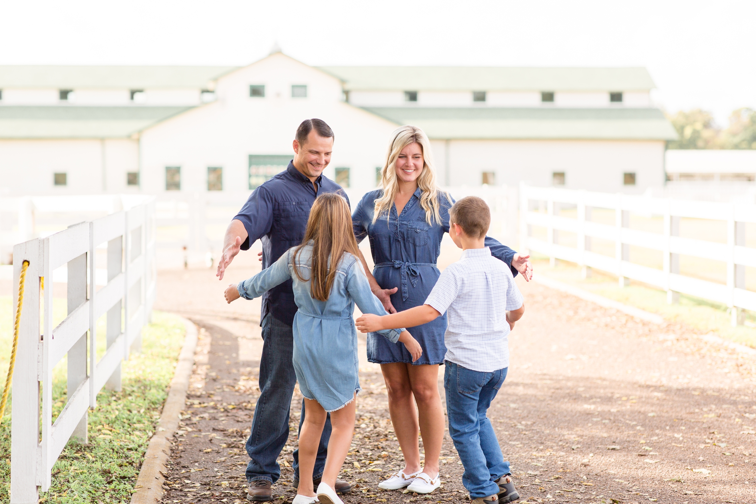 Kids run to give mom and dad hugs during family mini session at Harlinsdale Farm in Franklin, TN with family photographer and educator Rebecca Rice of Rebecca Rice Photography. Click to see more from this set of minis live on the blog now! 