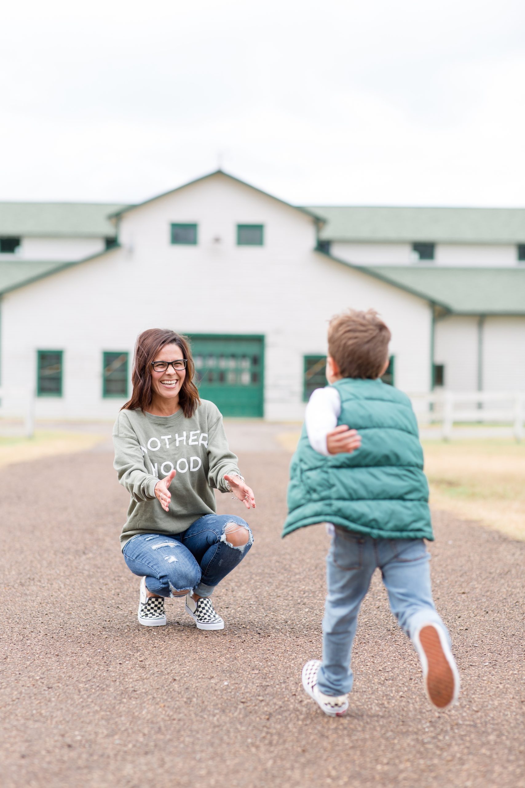 Boy runs to hug mom during fall mini session at Harlinsdale Farm in Franklin, TN. Click to see more from this set of minis live on the blog now! 