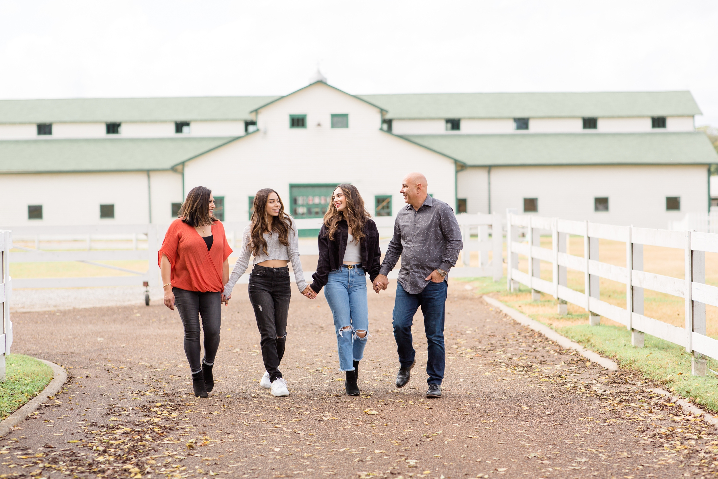 Family of 4 walks hand in hand down gravel road in front of farm in Franklin, TN during family mini session with family photographer and educator Rebecca Rice of Rebecca Rice Photography. Click to see more from this set of minis at Harlinsdale Farm live on the blog now!