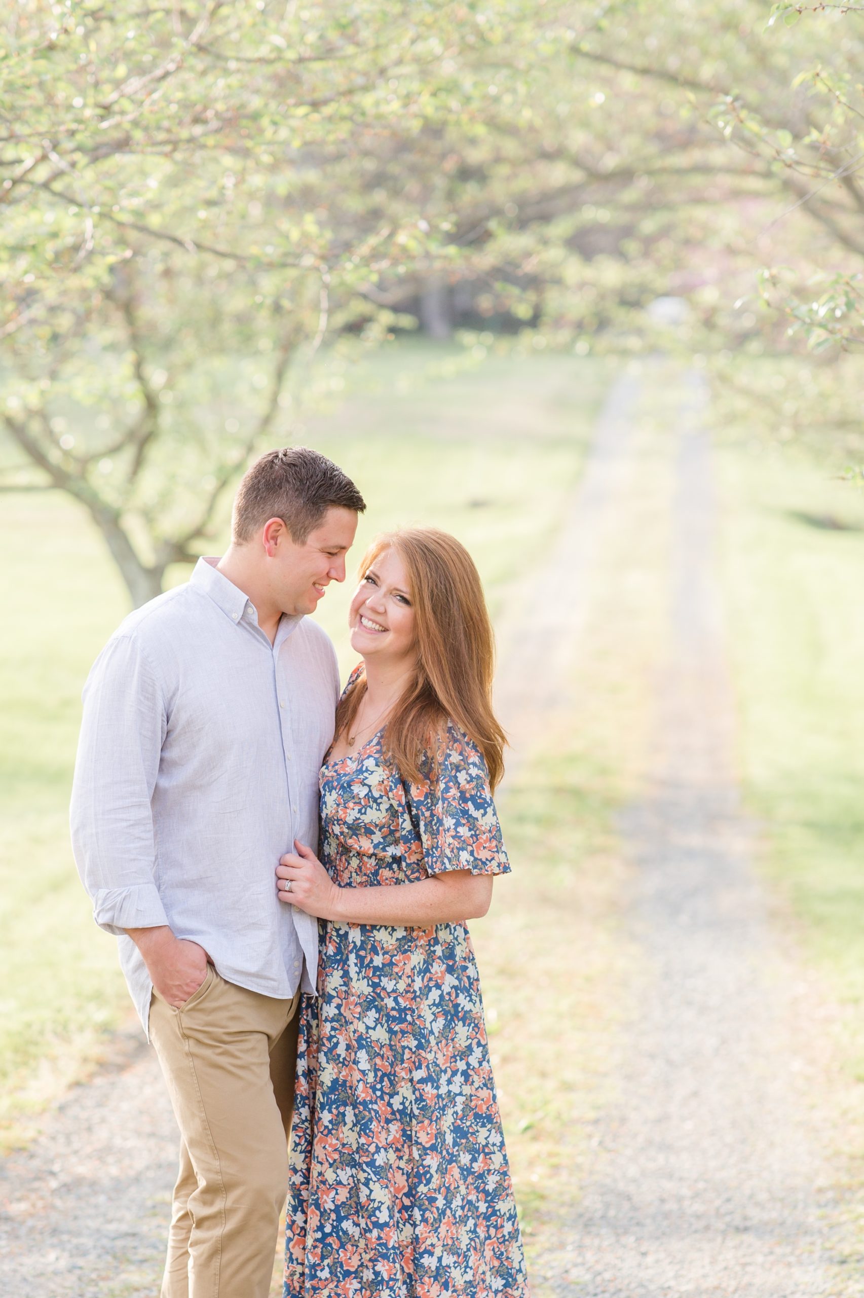 Parents pose without kids during family portrait session in the spring on gravel road on farm in Richmond, VA. Click to see more from this session live on the blog now! 