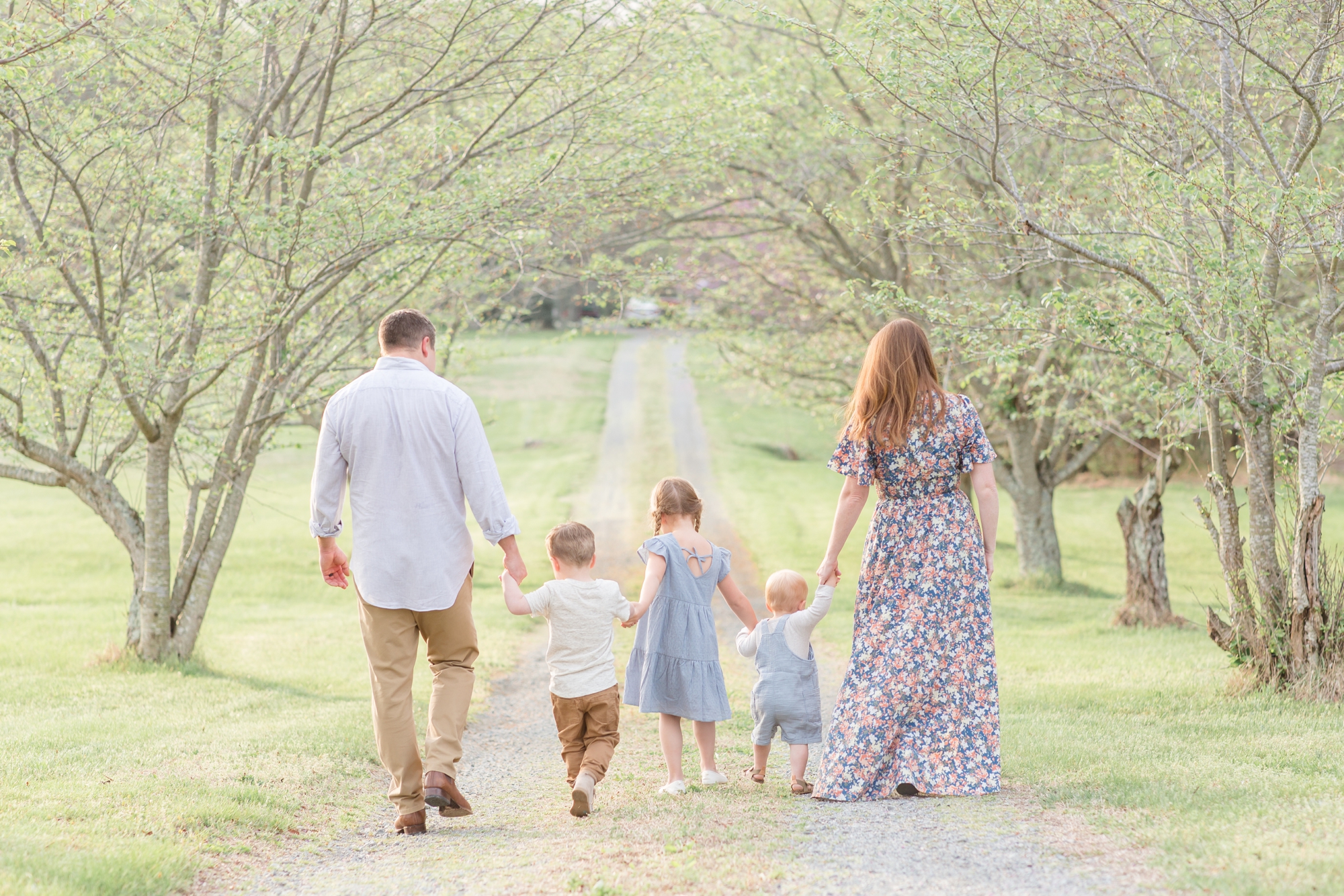 Family of 5 poses on gravel path between trees during family portrait session in the spring in Richmond, Virginia with family photographer and educator Rebecca Rice of Rebecca Rice Photography. Click to seem more from this sweet session live on the blog now! 