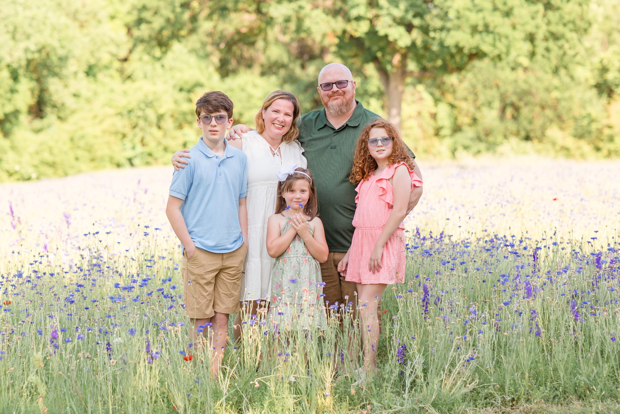 Family of 5 poses in field of wildflowers in RIchardson, Texas during wildflower mini sessions with family photographer and educator Rebecca Rice of Rebecca Rice Photography. Click to see more from this session live on the blog now!