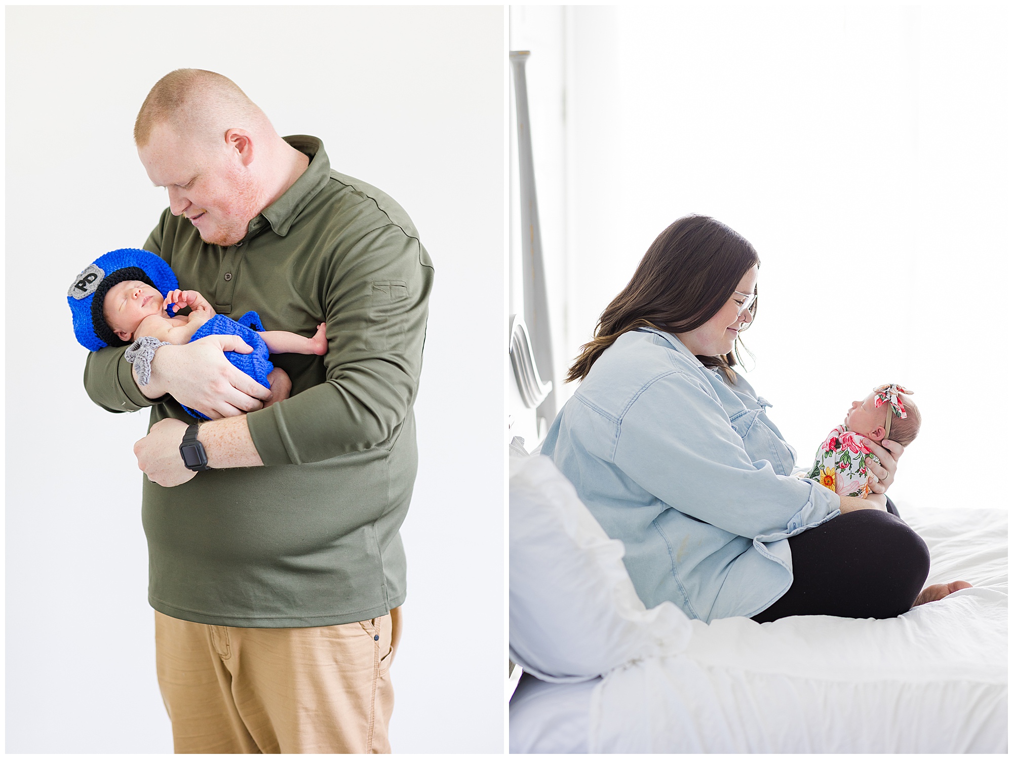 Dad in green shirt and khaki pants holds newborn daughter in knit baby police outfit during lifestyle newborn session. Mom in light blue button down and black pants sits on white bed whiling holding and smiling at newborn baby. 