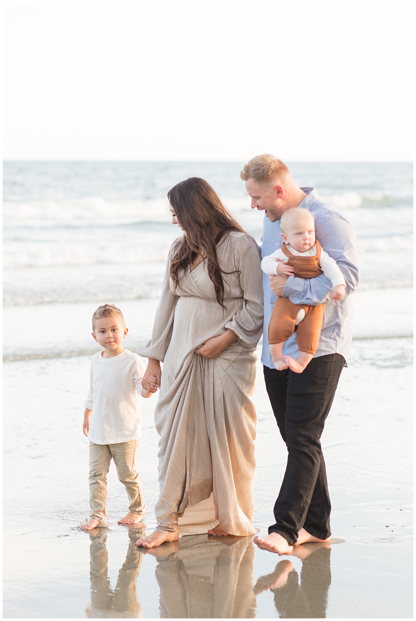 Family photographer, Rebecca Rice, captures family walking down the beach of the Isle of Palms beach in Charleston, SC.