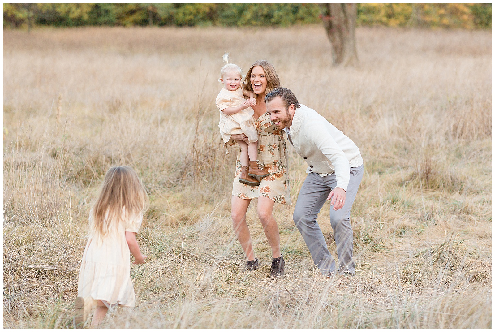 Family of 4 wear coordinating color outfits of cream, gold, and floral as they enjoy time as family during their family session with Nashville family photographer, Rebecca Rice. 